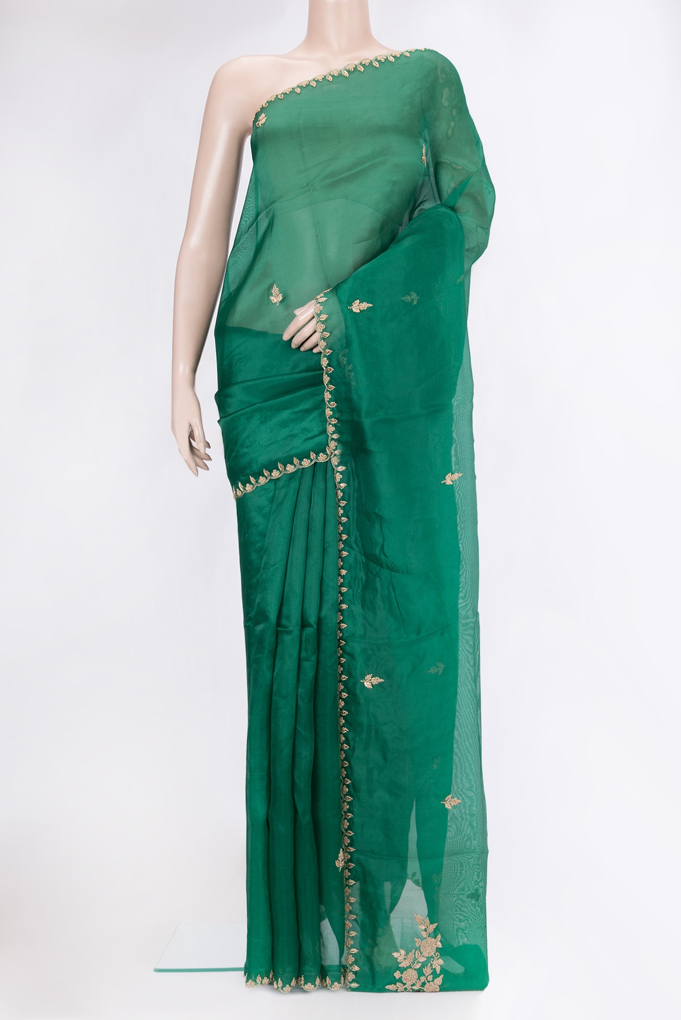 Green Organza Silk Saree with Embroidery on the body and Embroidery Border.  displayed on a mannequin