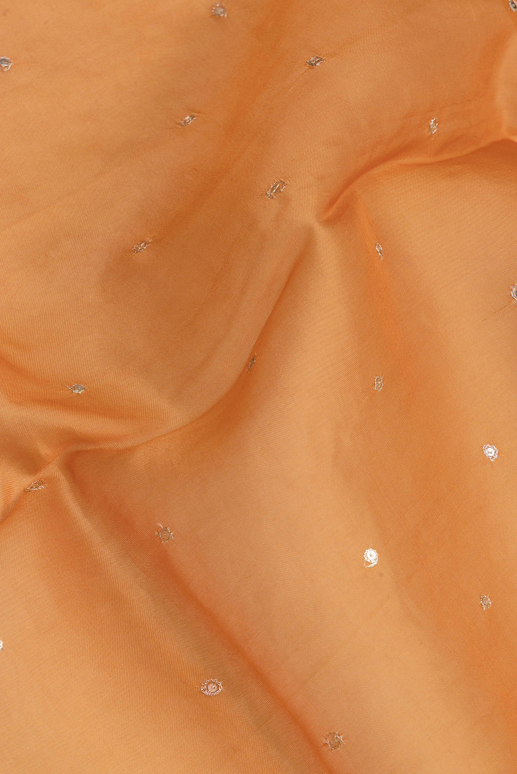 Close up of Orange Dual Tone Organza Silk Saree with Embroidery on the body and Embroidery Border.  displaying folds