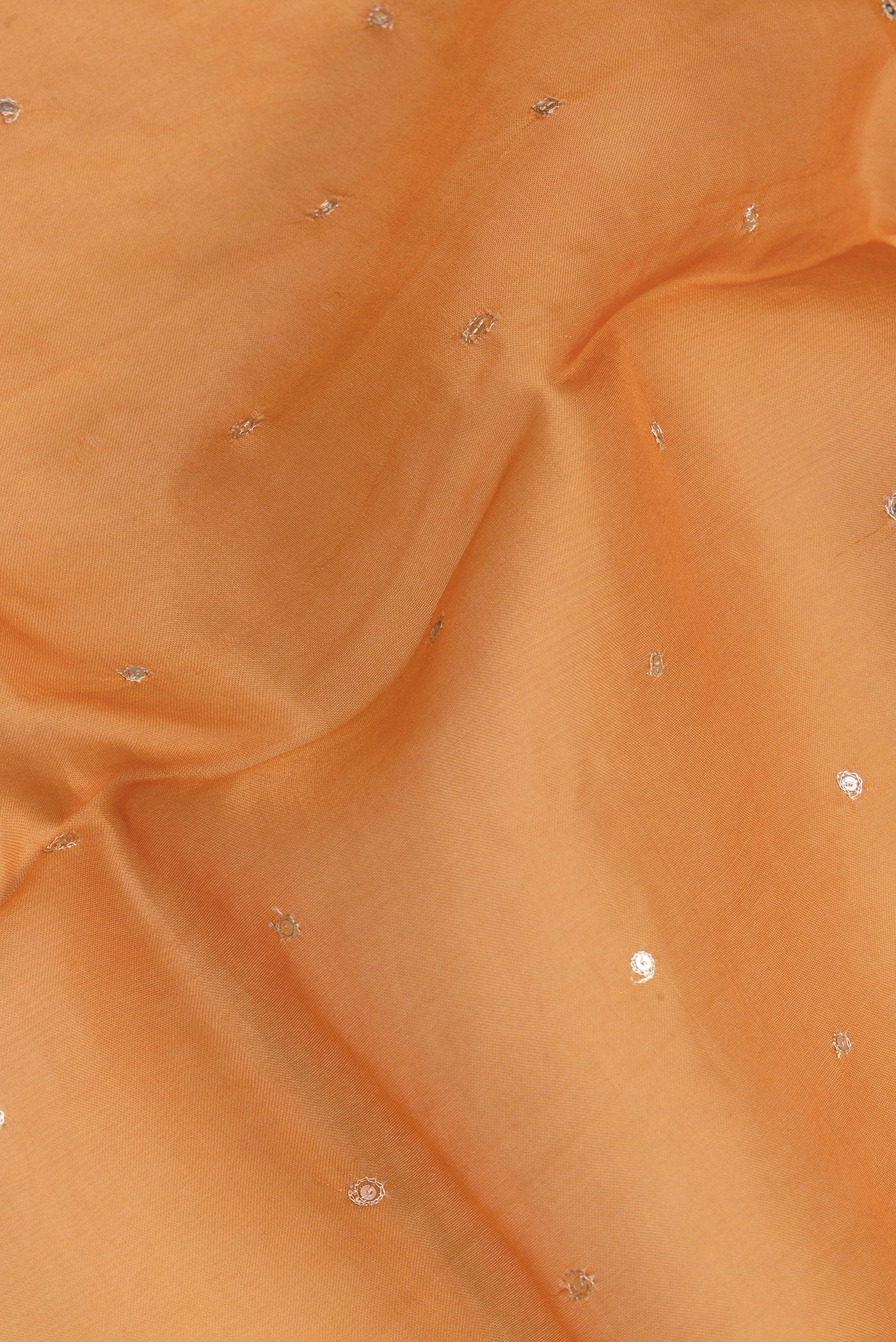 Close up of Orange Dual Tone Organza Silk Saree with Embroidery on the body and Embroidery Border.  displaying folds