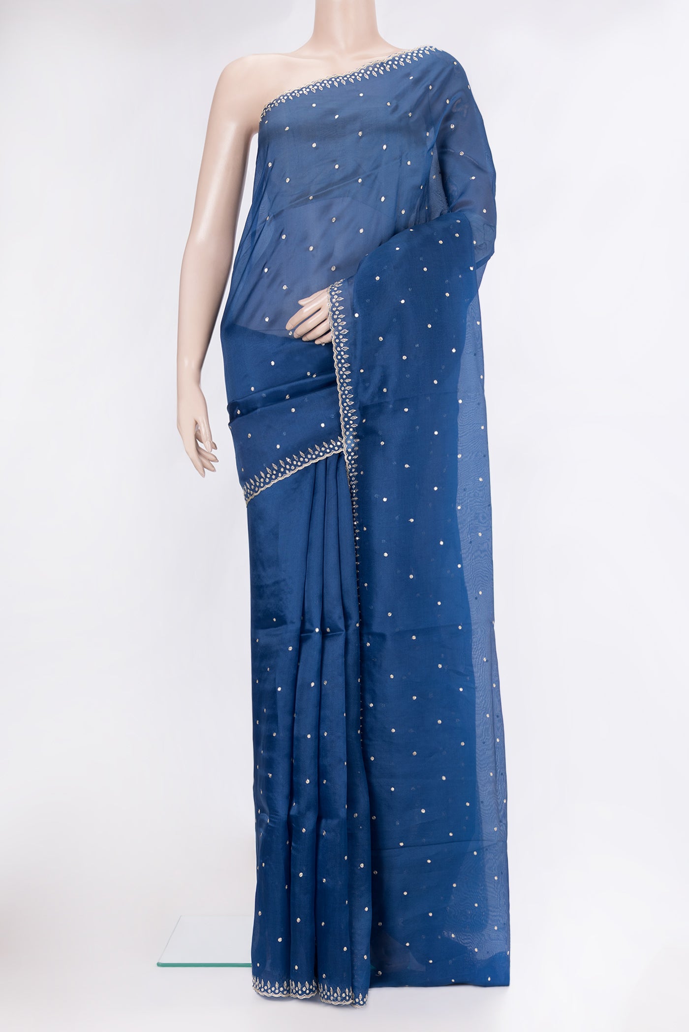 Blue Organza Silk Saree with Embroidery on the body and Embroidery Border.  displayed on a mannequin