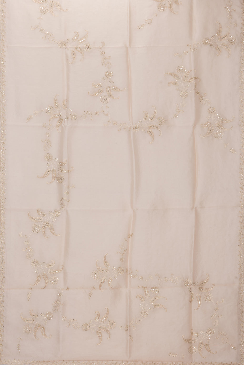 Flat view of Rose Gold Organza Silk Saree with Embroidery on the body and Sequin Border. 