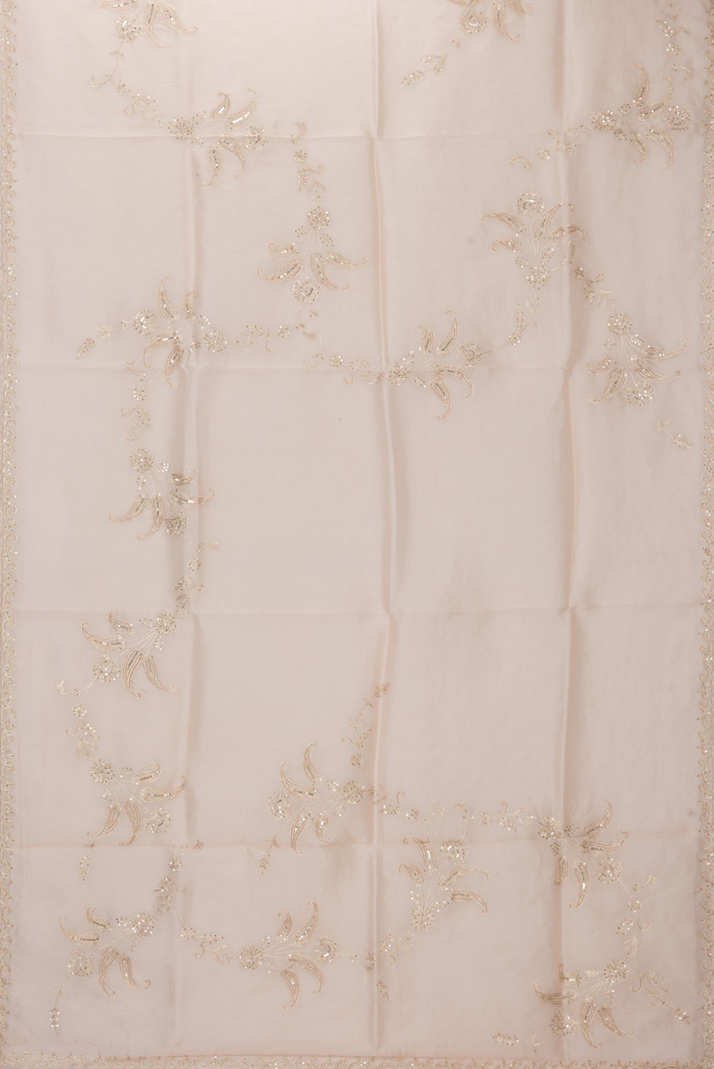 Flat view of Rose Gold Organza Silk Saree with Embroidery on the body and Sequin Border. 