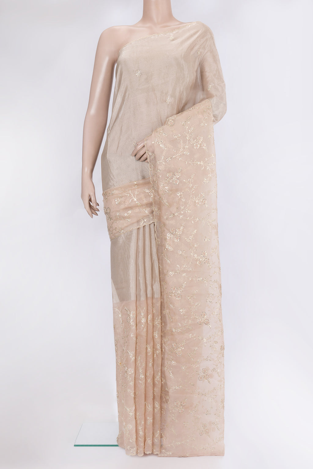 Golden Peach Organza Silk Saree with Embroidery on the body and Embroidery Border.  displayed on a mannequin