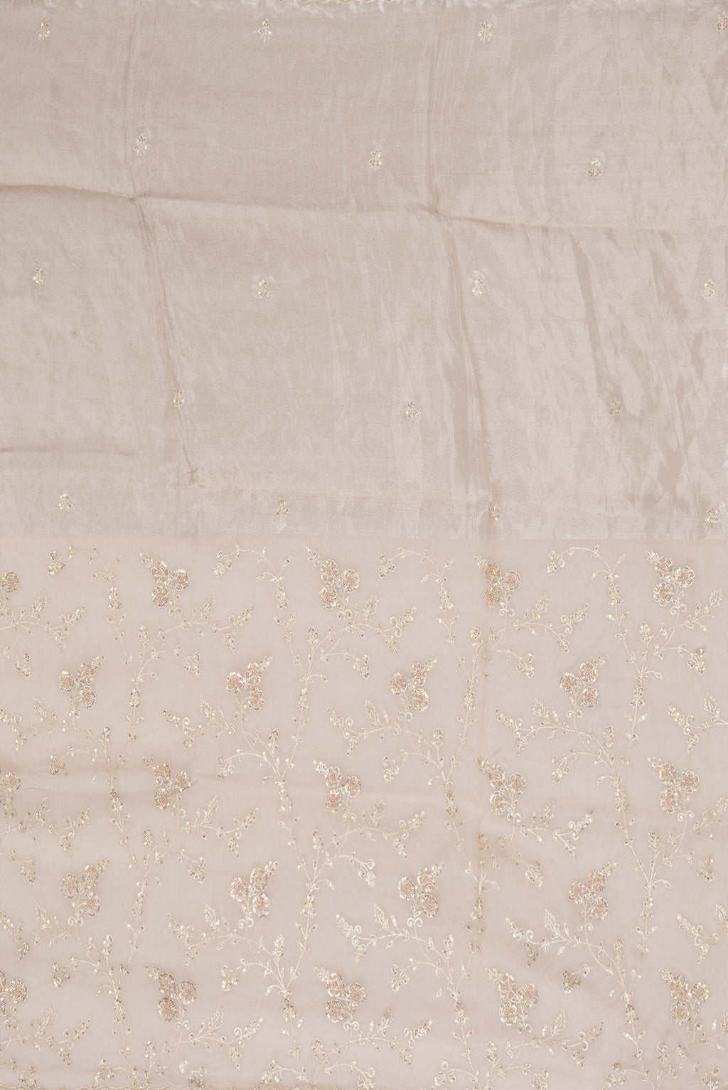 Close up image of the pallu of Golden Peach Organza Silk Saree with Embroidery on the body and Embroidery Border. 