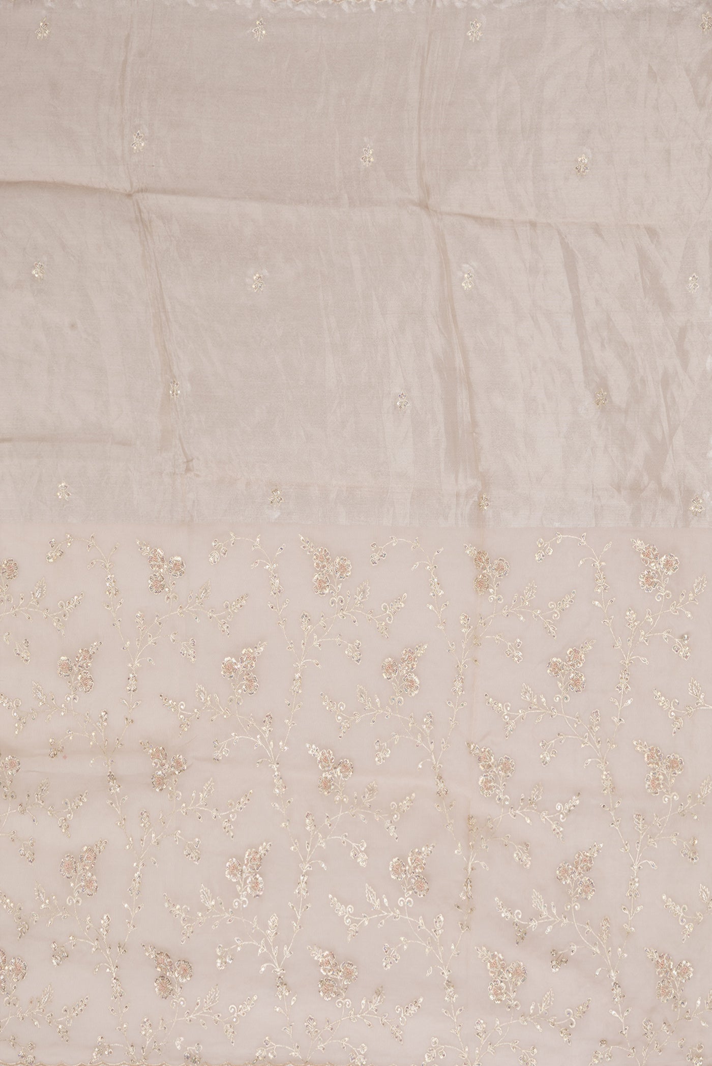 Close up image of the pallu of Golden Peach Organza Silk Saree with Embroidery on the body and Embroidery Border. 