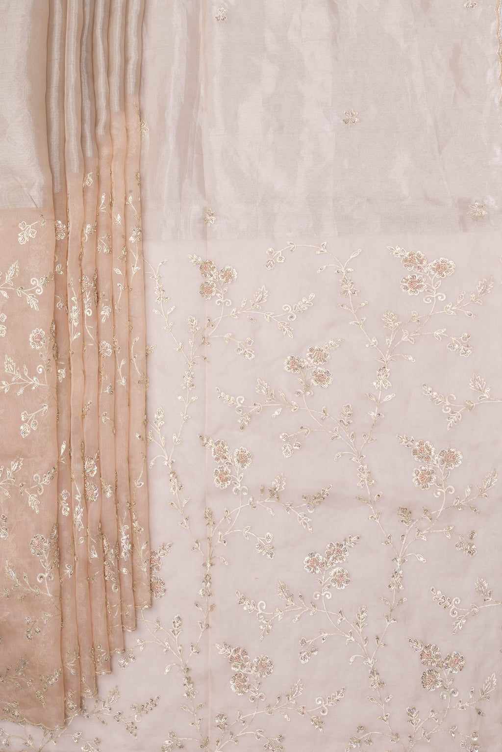 Pleats and pallu of Golden Peach Organza Silk Saree with Embroidery on the body and Embroidery Border. 