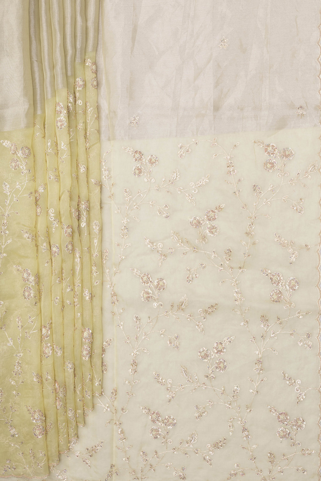 Pleats and pallu of Lemon Yellow Organza Silk Saree with Embroidery on the body and Embroidery Border. 