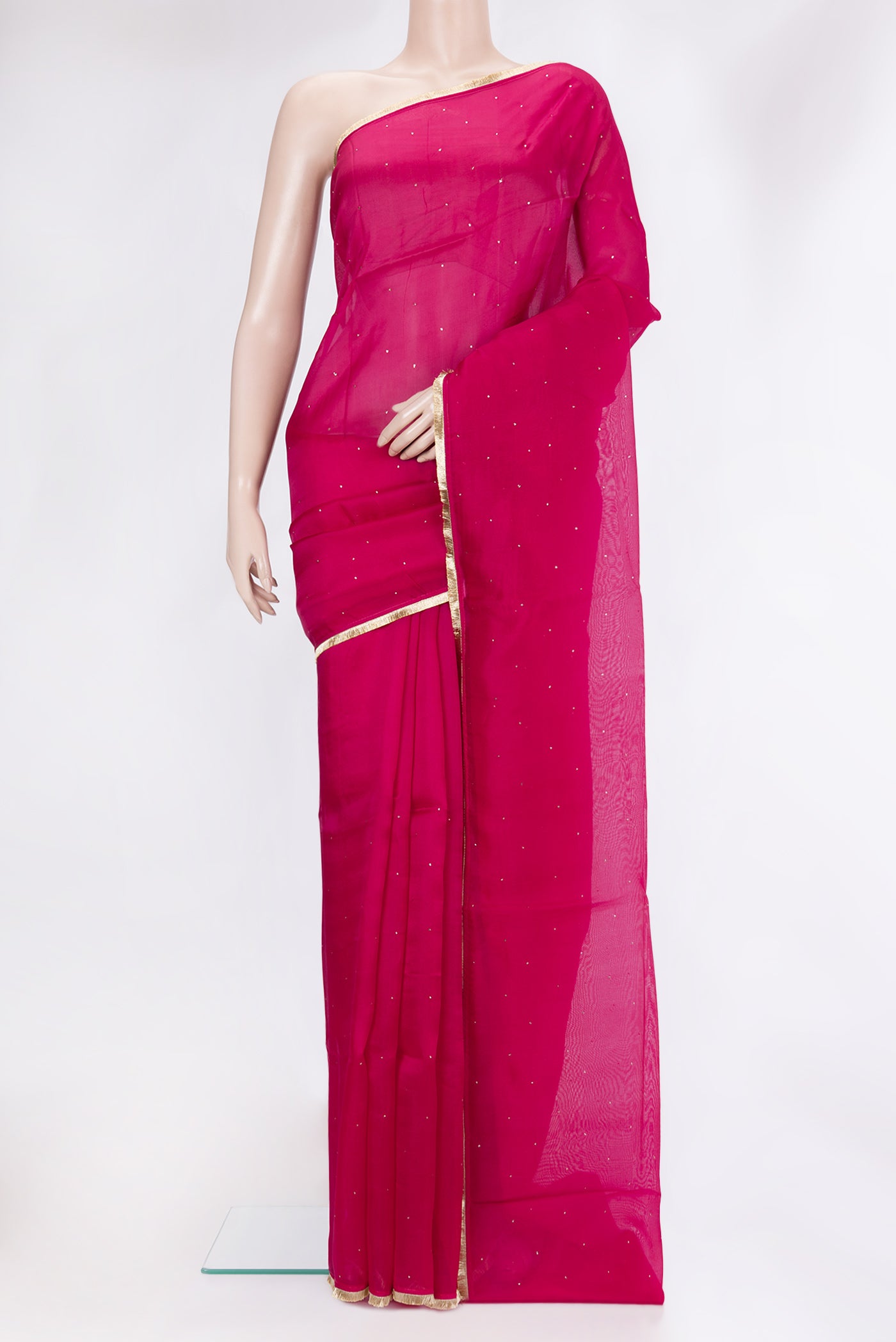Dark Pink Organza Silk Saree with Embroidery on the body and Zari Border.  displayed on a mannequin