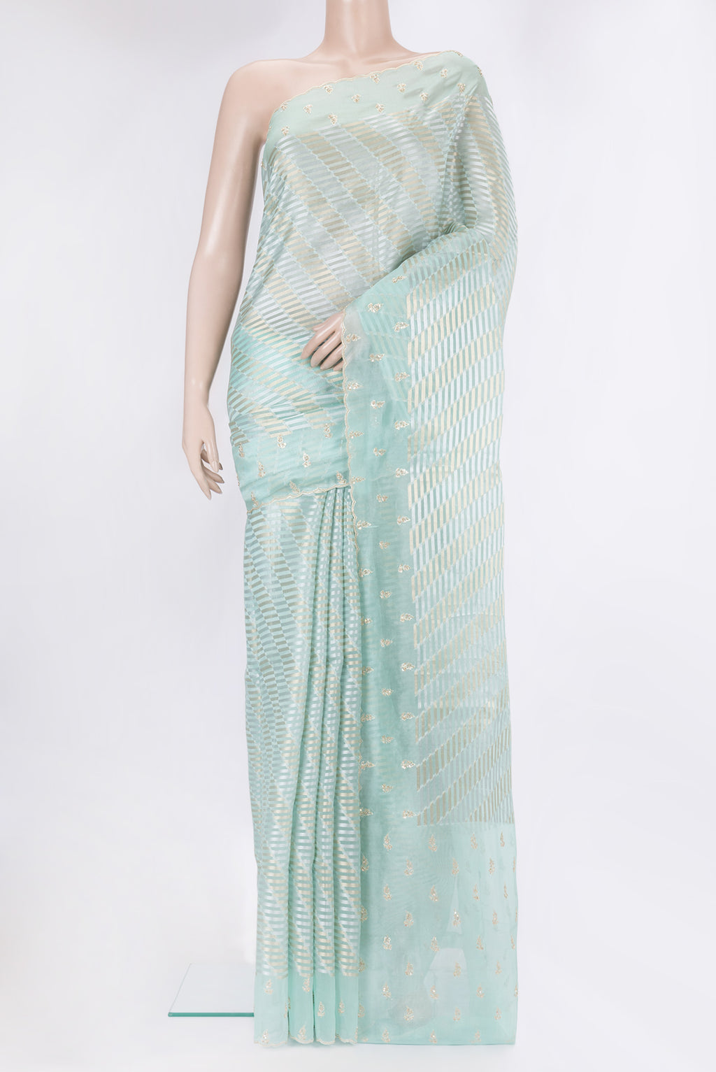 Sky Blue Organza Silk Saree with Zari Brocade on the body and Sequin Border.  displayed on a mannequin