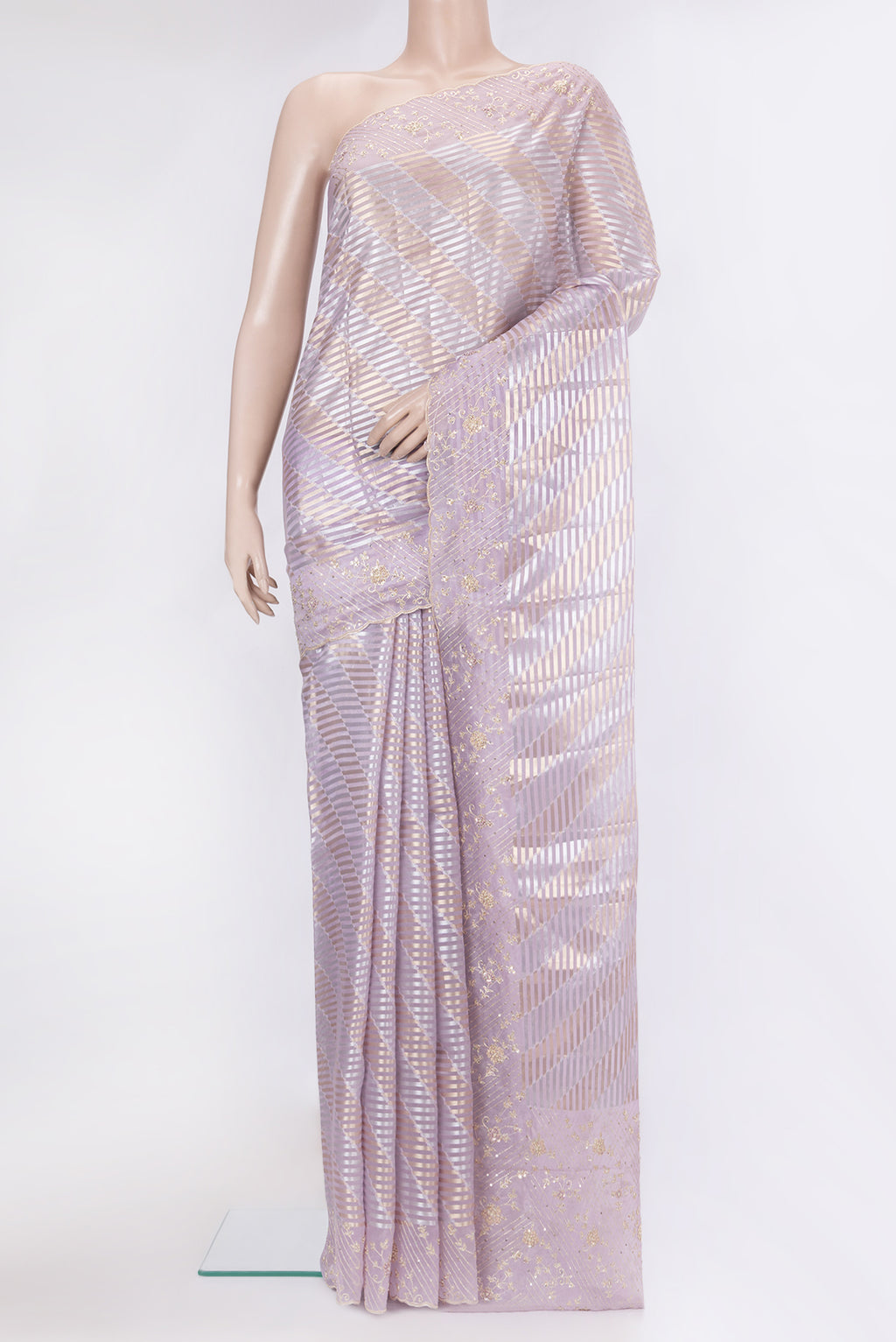 Lavender Organza Silk Saree with Zari Brocade on the body and Sequin Border.  displayed on a mannequin