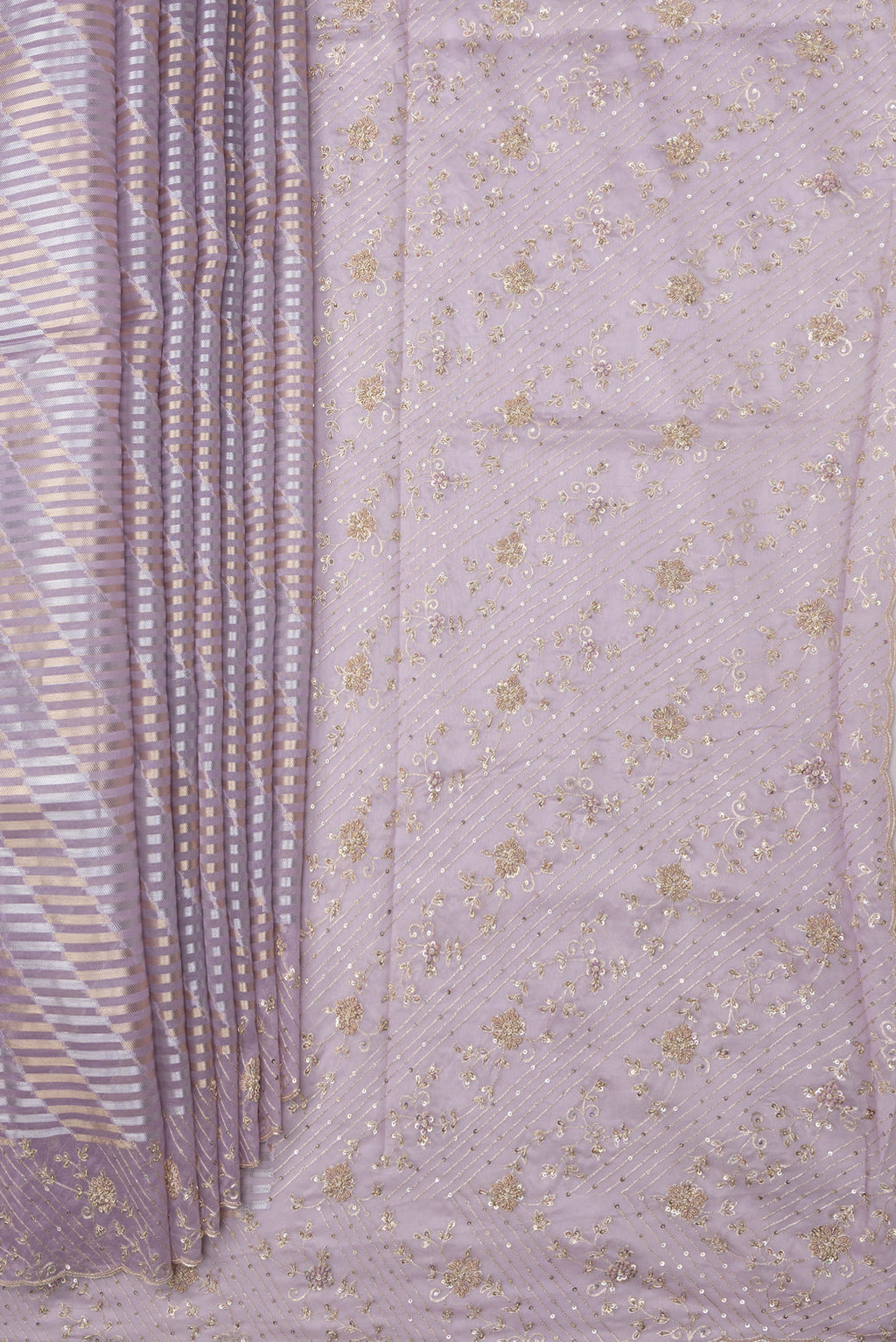 Pleats and pallu of Lavender Organza Silk Saree with Zari Brocade on the body and Sequin Border. 