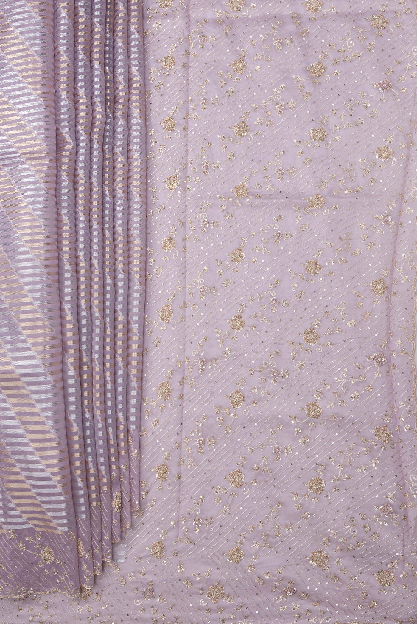 Pleats and pallu of Lavender Organza Silk Saree with Zari Brocade on the body and Sequin Border. 