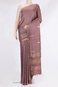 Brown Tussar Silk Saree with Embroidery on the body and Zari Border.  displayed on a mannequin