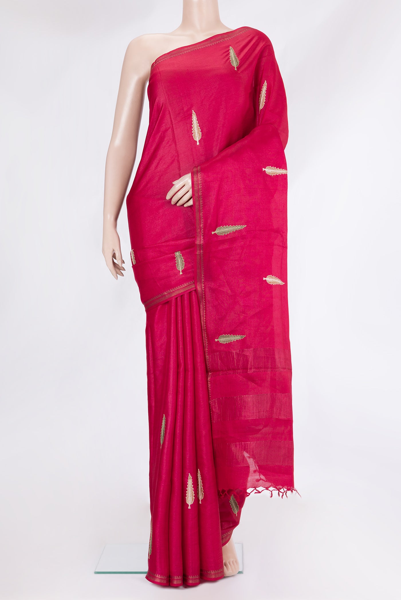 Dark Pink Tussar Silk Saree with Embroidery on the body and Zari Border.  displayed on a mannequin