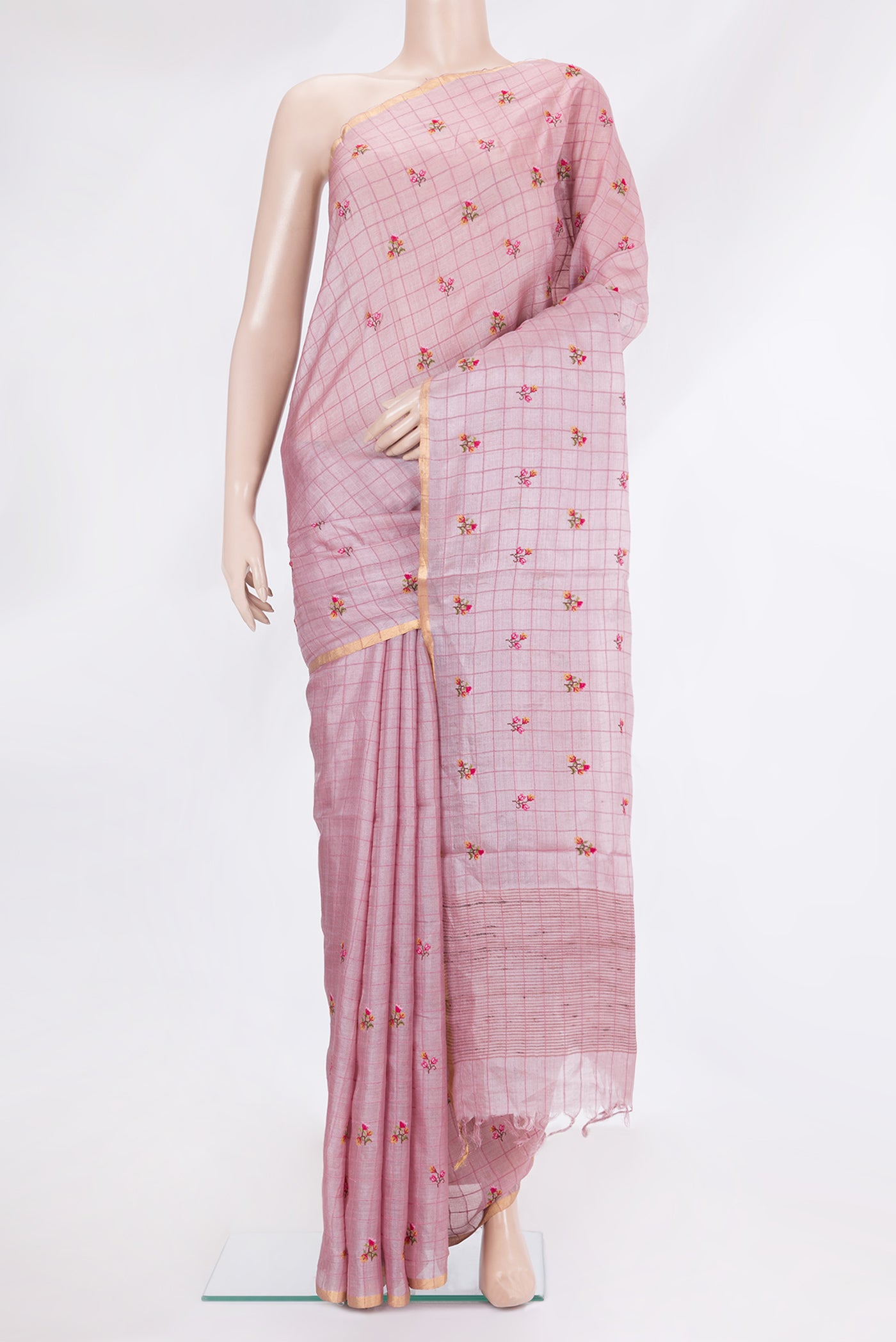 Pink Tussar Silk Saree with Checked design on the body and Zari Border.  displayed on a mannequin