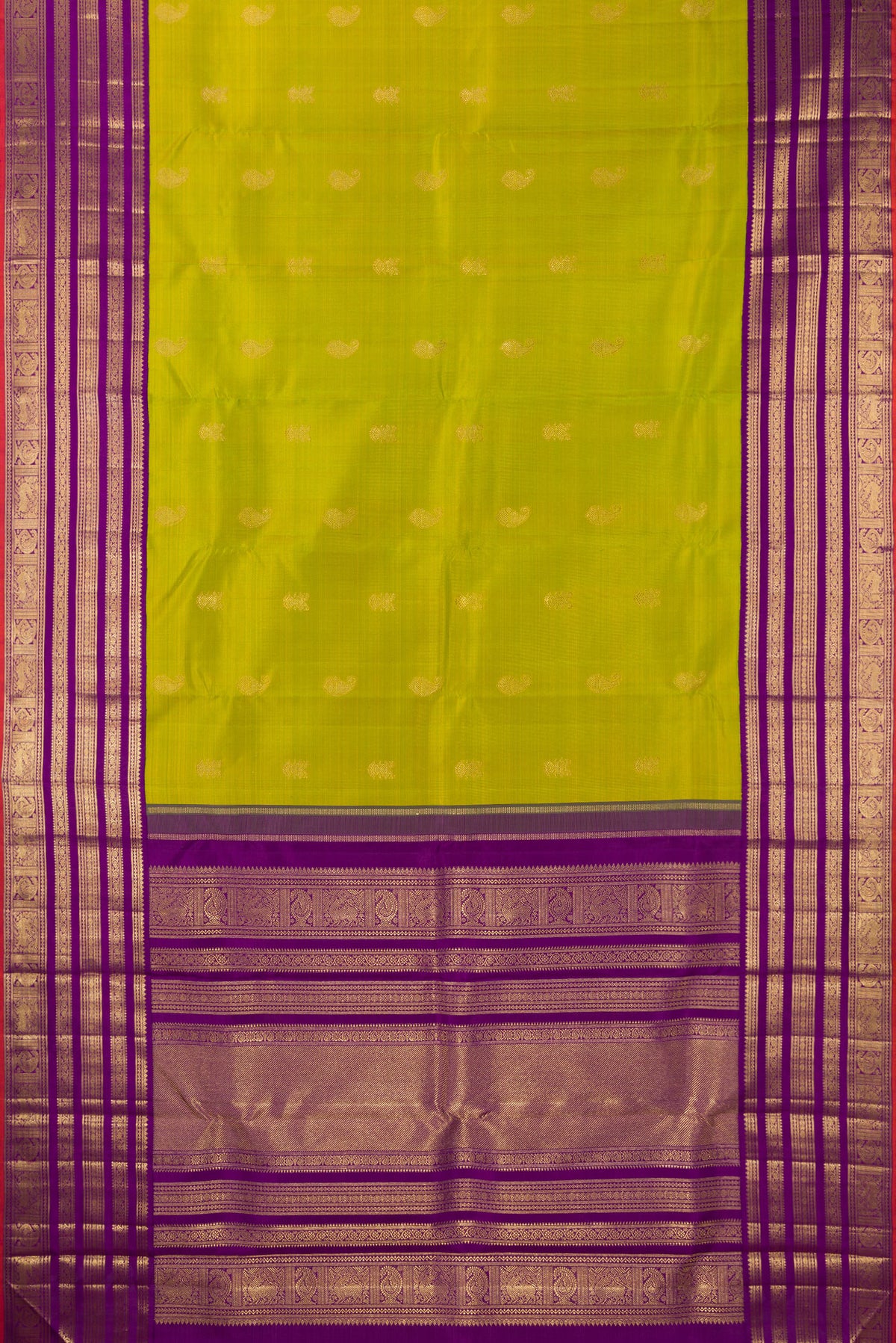 Flat view of Pure Silk Pure Zari Parrot Green Kanjivaram Saree with Zari Butta on the body and Fancy Border. 