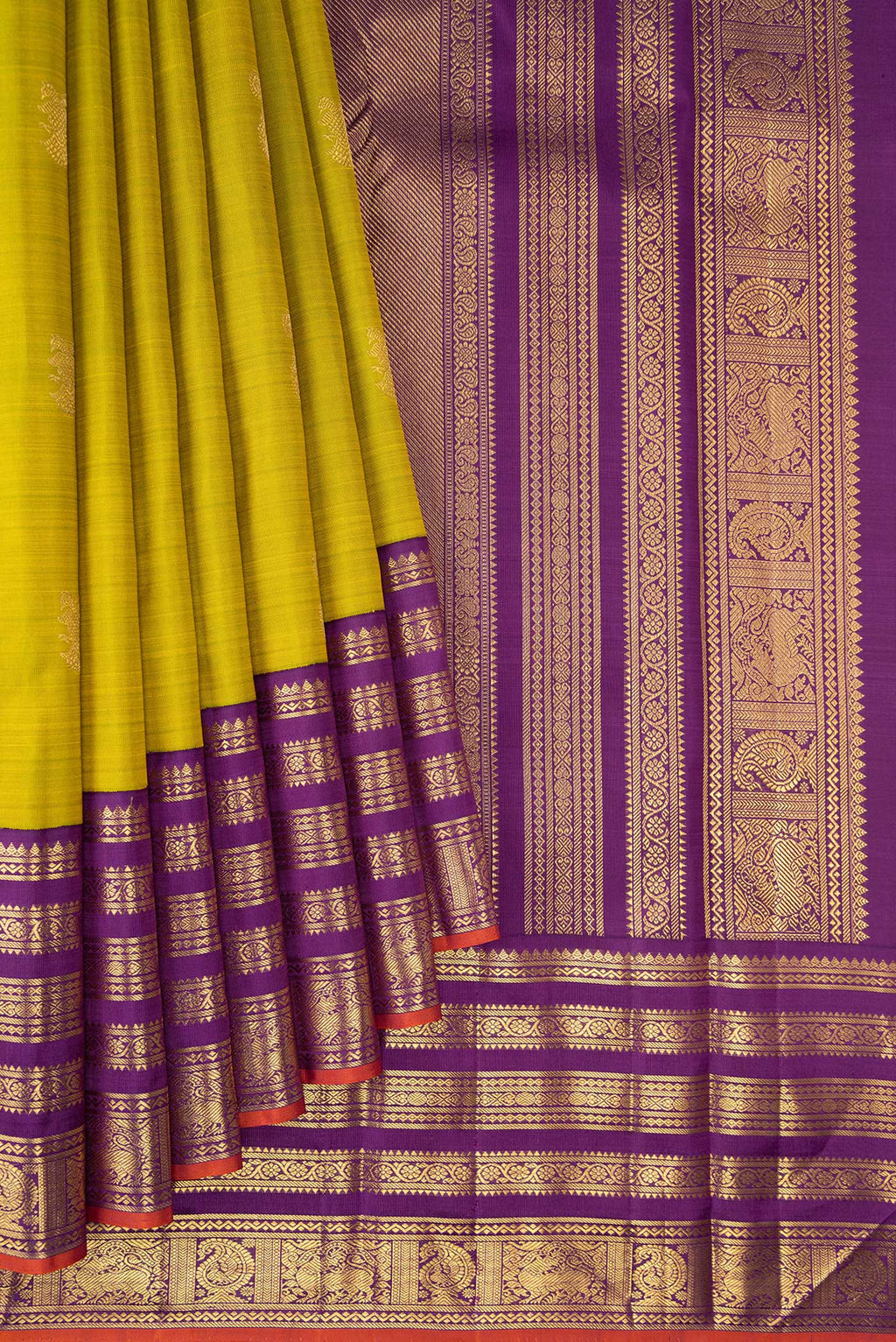 Pleats and pallu of Pure Silk Pure Zari Parrot Green Kanjivaram Saree with Zari Butta on the body and Fancy Border. 