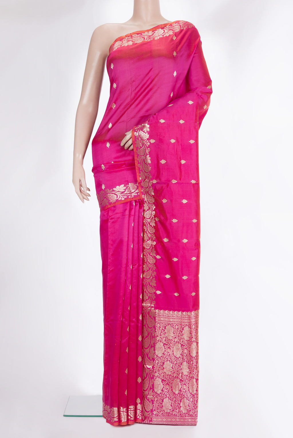 Pure Silk Pink Banarasi Saree with Zari Butta on the body and Zari Border.  displayed on a mannequin