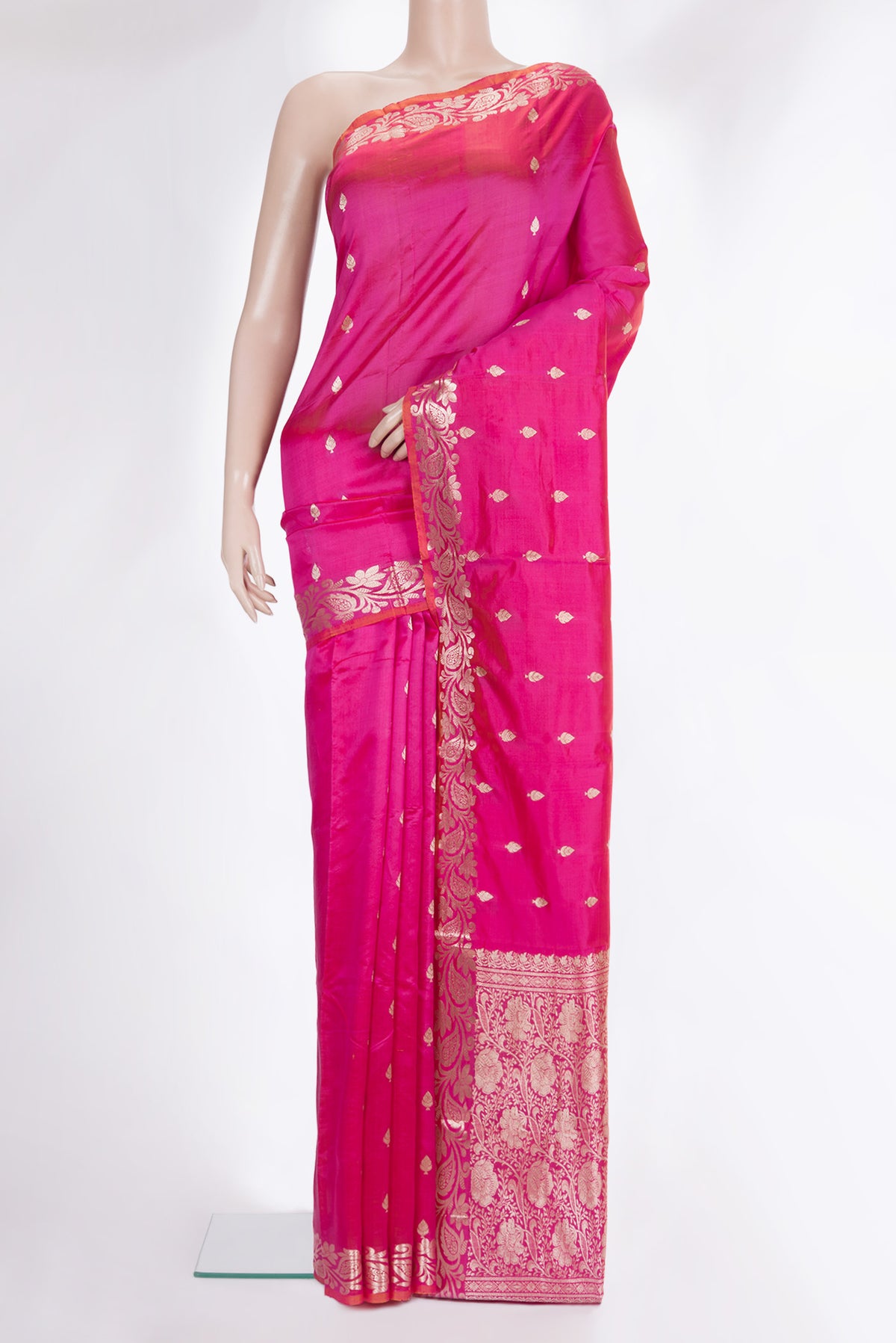 Pure Silk Pink Banarasi Saree with Zari Butta on the body and Zari Border.  displayed on a mannequin