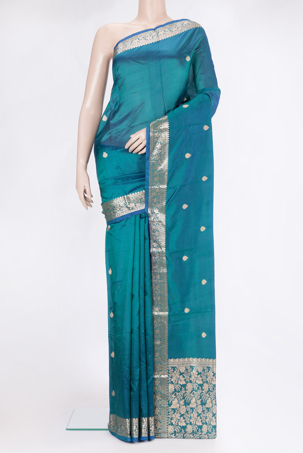 Peacock Blue Banarasi Silk Saree with Zari Butta on the body and Zari Border.  displayed on a mannequin