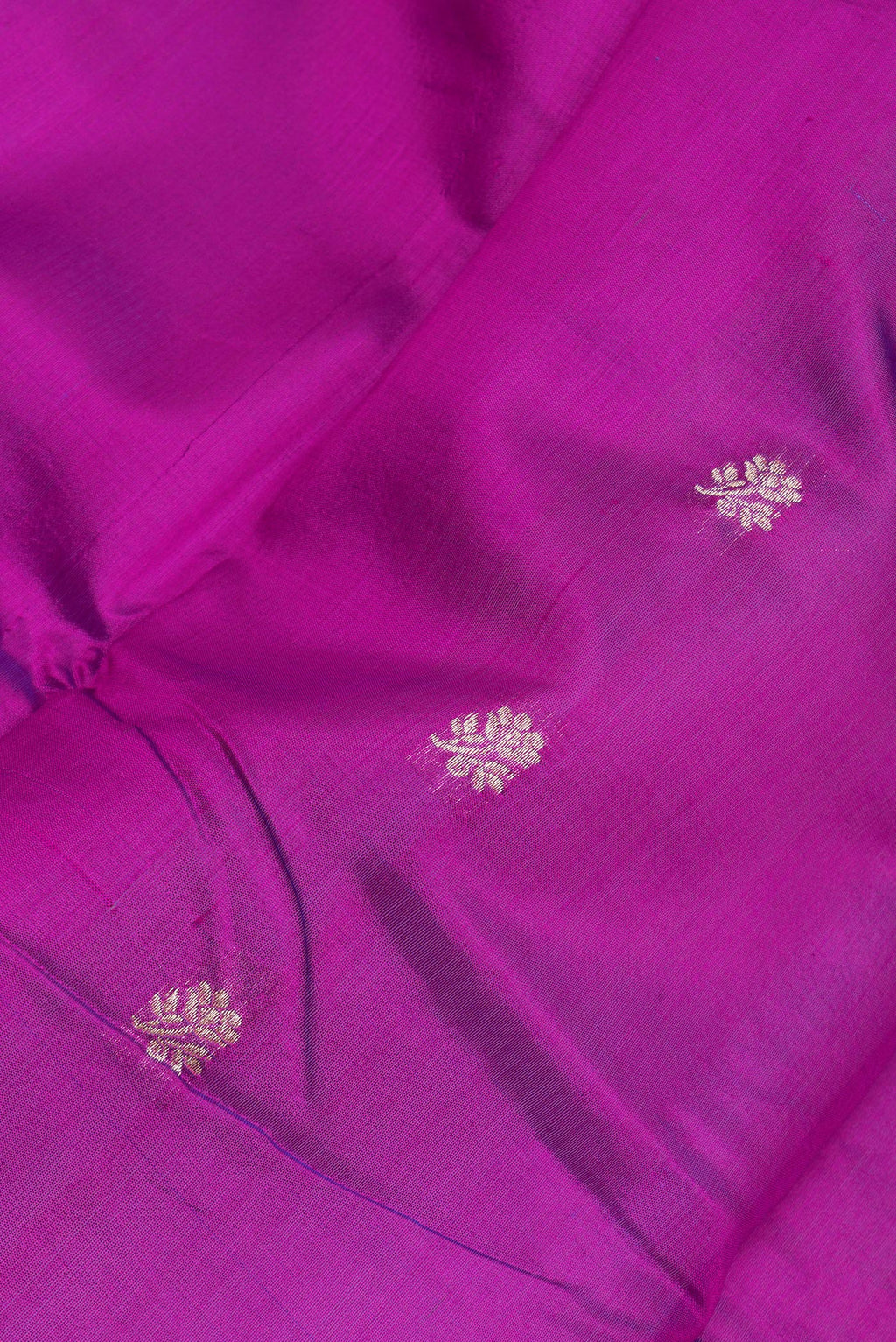 Close up of Purple Banarasi Silk Saree with Zari Butta on the body and Zari Border.  displaying folds
