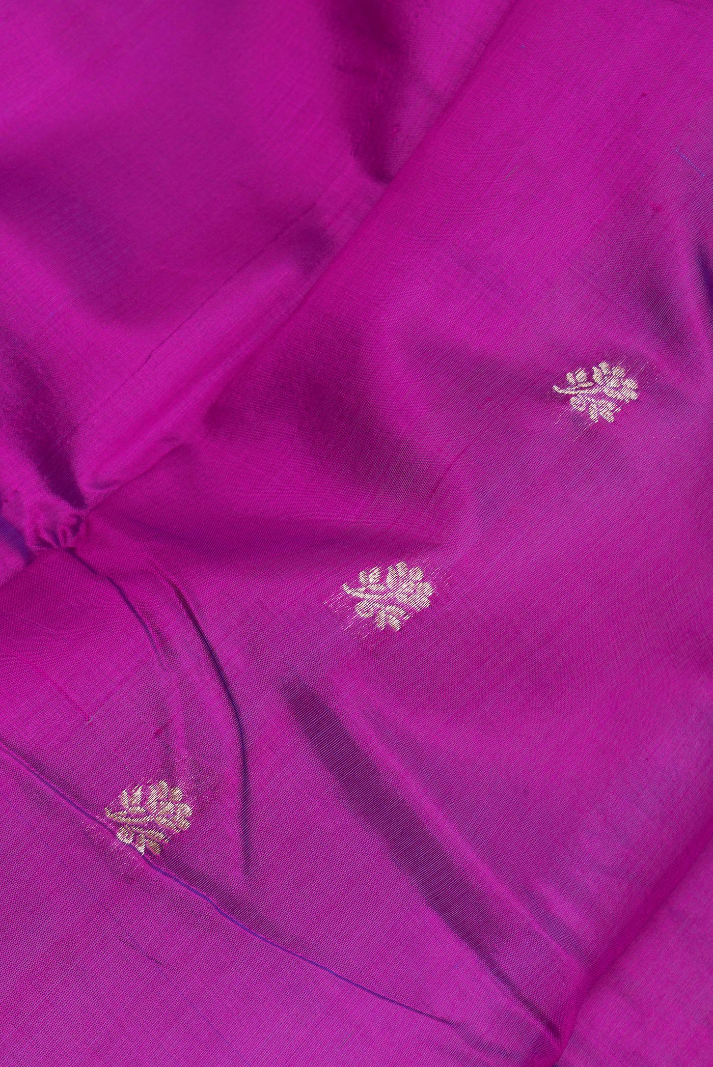 Close up of Purple Banarasi Silk Saree with Zari Butta on the body and Zari Border.  displaying folds