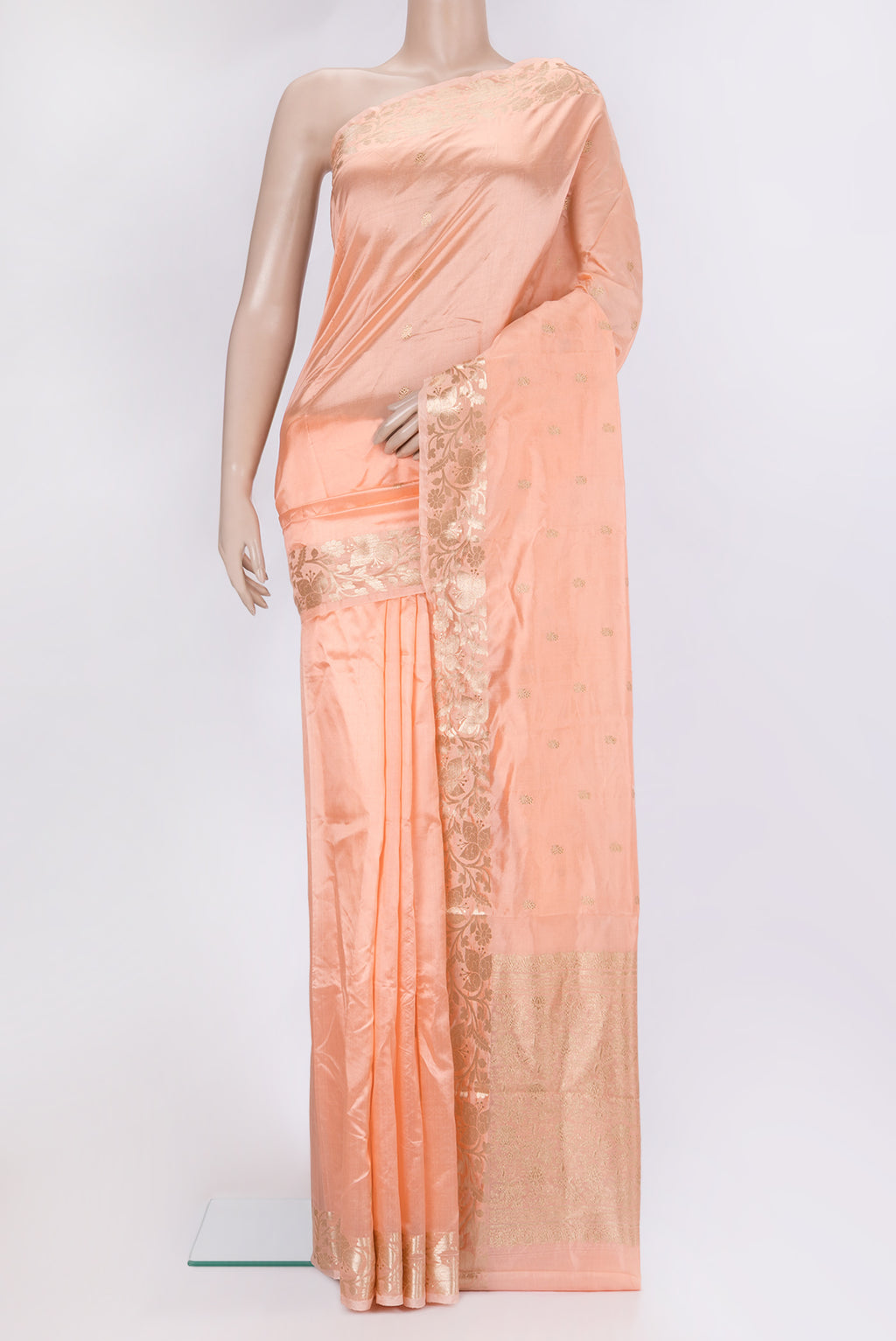 Peach Banarasi Silk Saree with Zari Butta on the body and Zari Border.  displayed on a mannequin