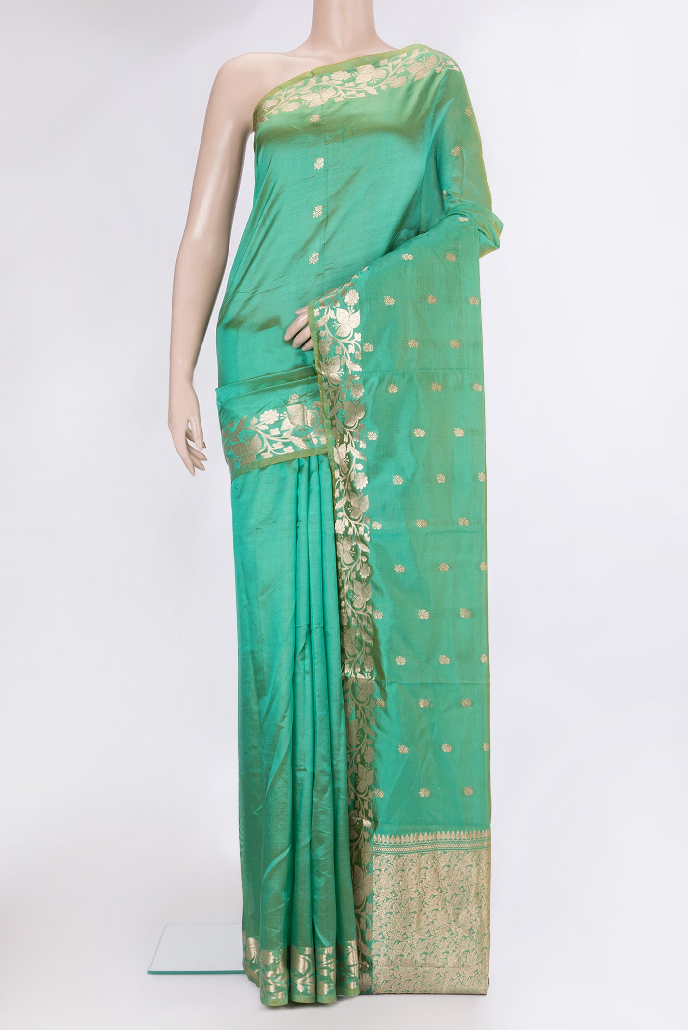 Sea Green Dual Tone Banarasi Silk Saree with Zari Butta on the body and Zari Border.  displayed on a mannequin