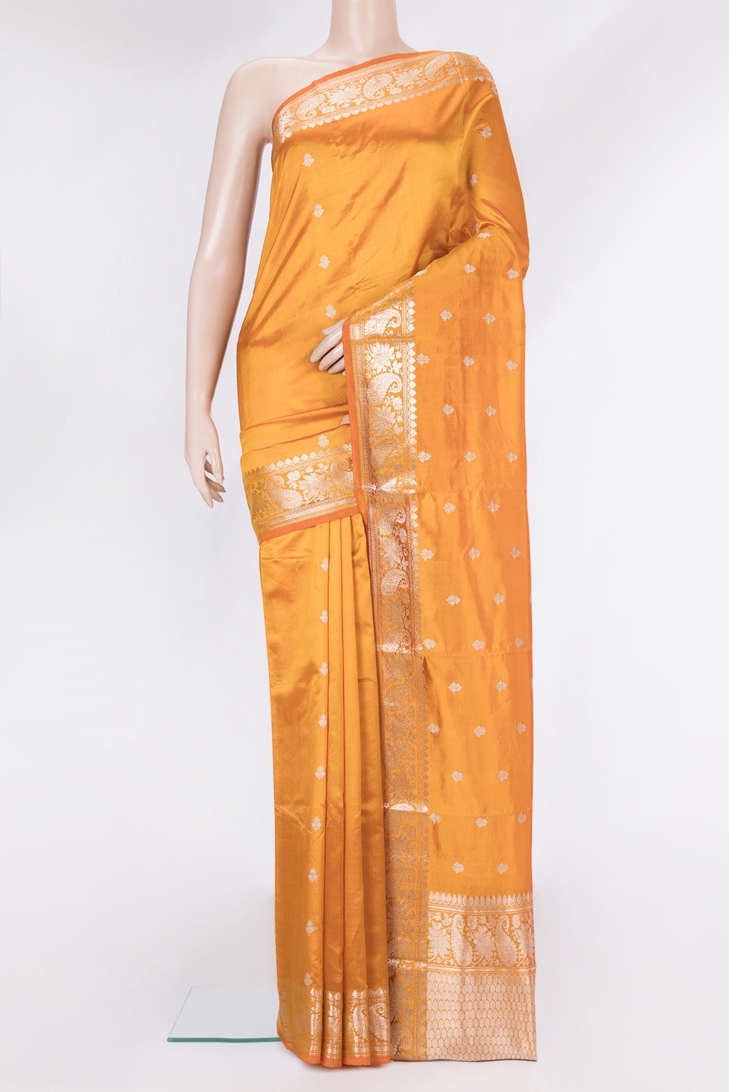 Orange Banarasi Silk Saree with Zari Butta on the body and Zari Border.  displayed on a mannequin