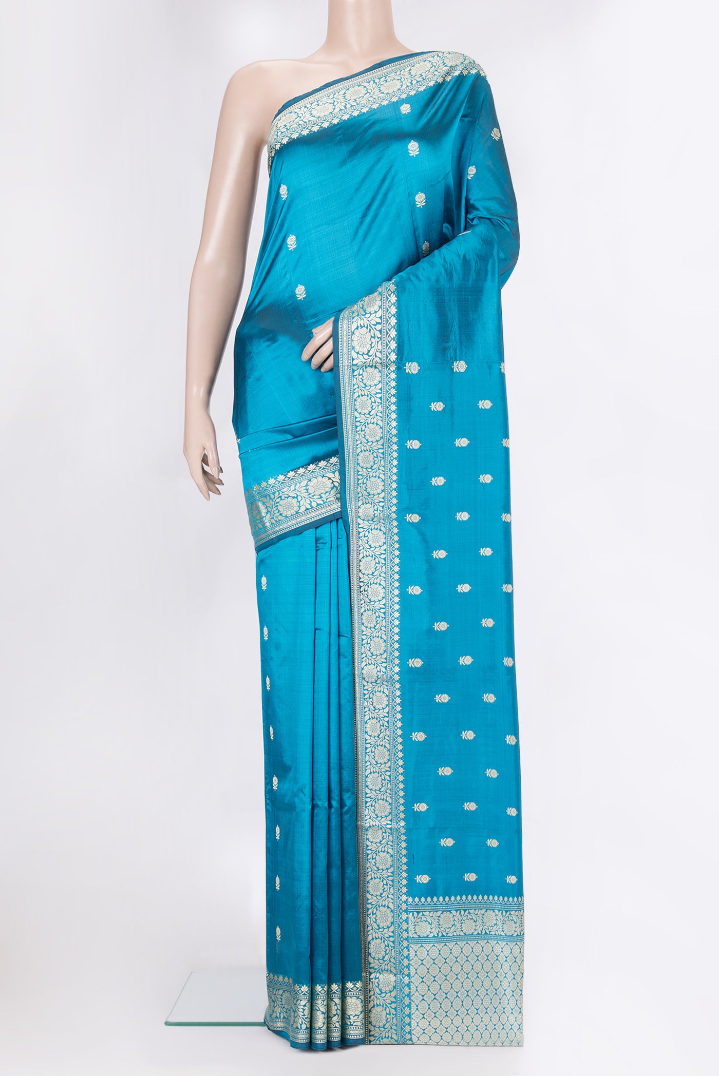 Peacock Blue Banarasi Silk Saree with Thread Butta on the body and Thread Border.  displayed on a mannequin
