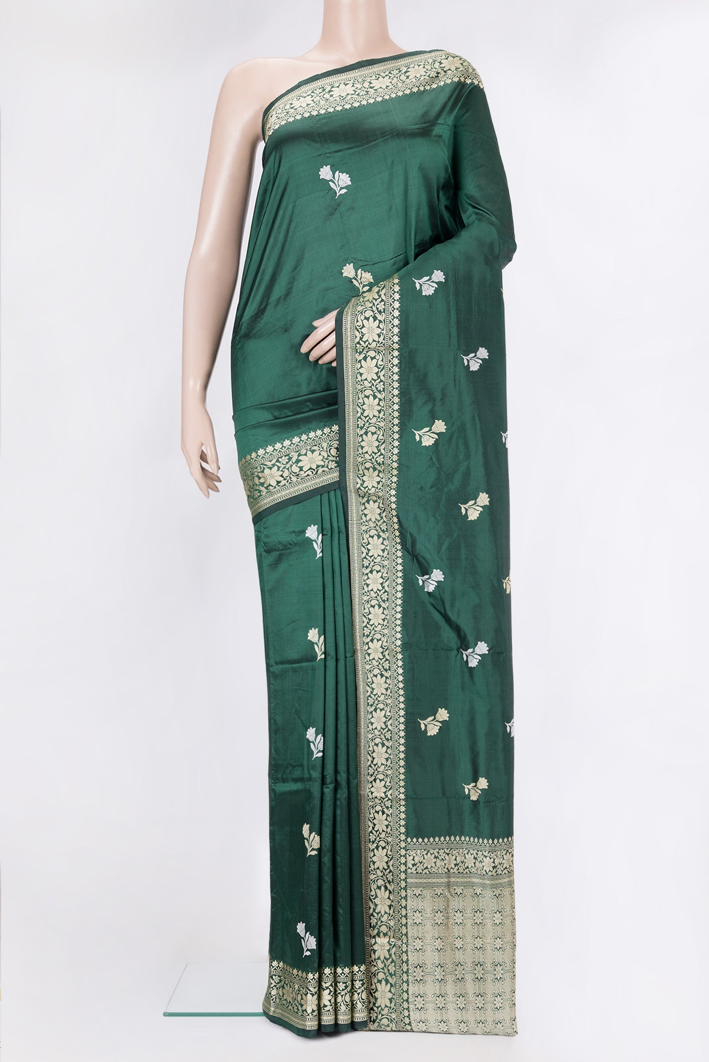 Bottle Green Banarasi Silk Saree with Thread Butta on the body and Thread Border.  displayed on a mannequin