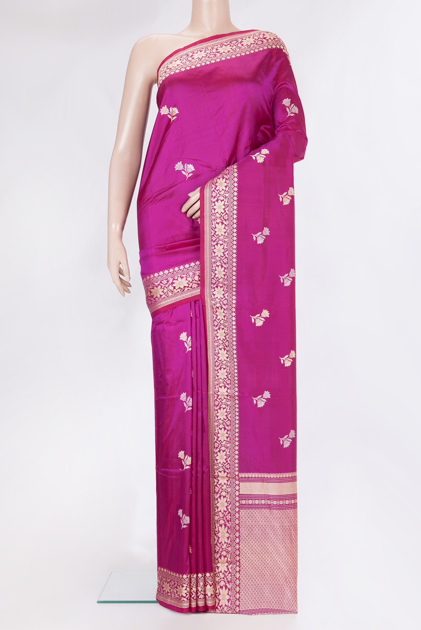 Magenta Banarasi Silk Saree with Thread Butta on the body and Thread Border.  displayed on a mannequin