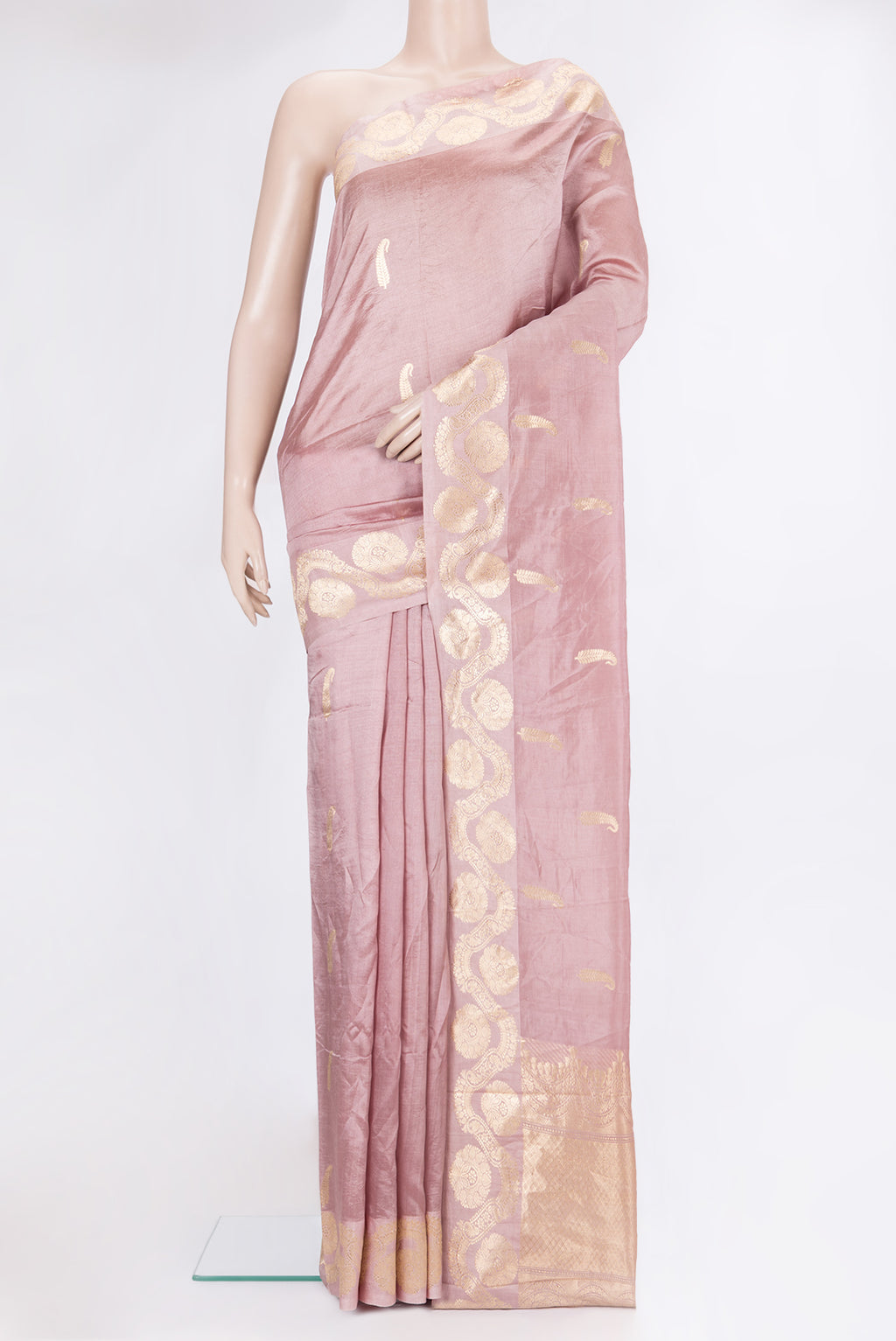 Rose Gold Banarasi Silk Saree with Zari Butta on the body and Zari Border.  displayed on a mannequin