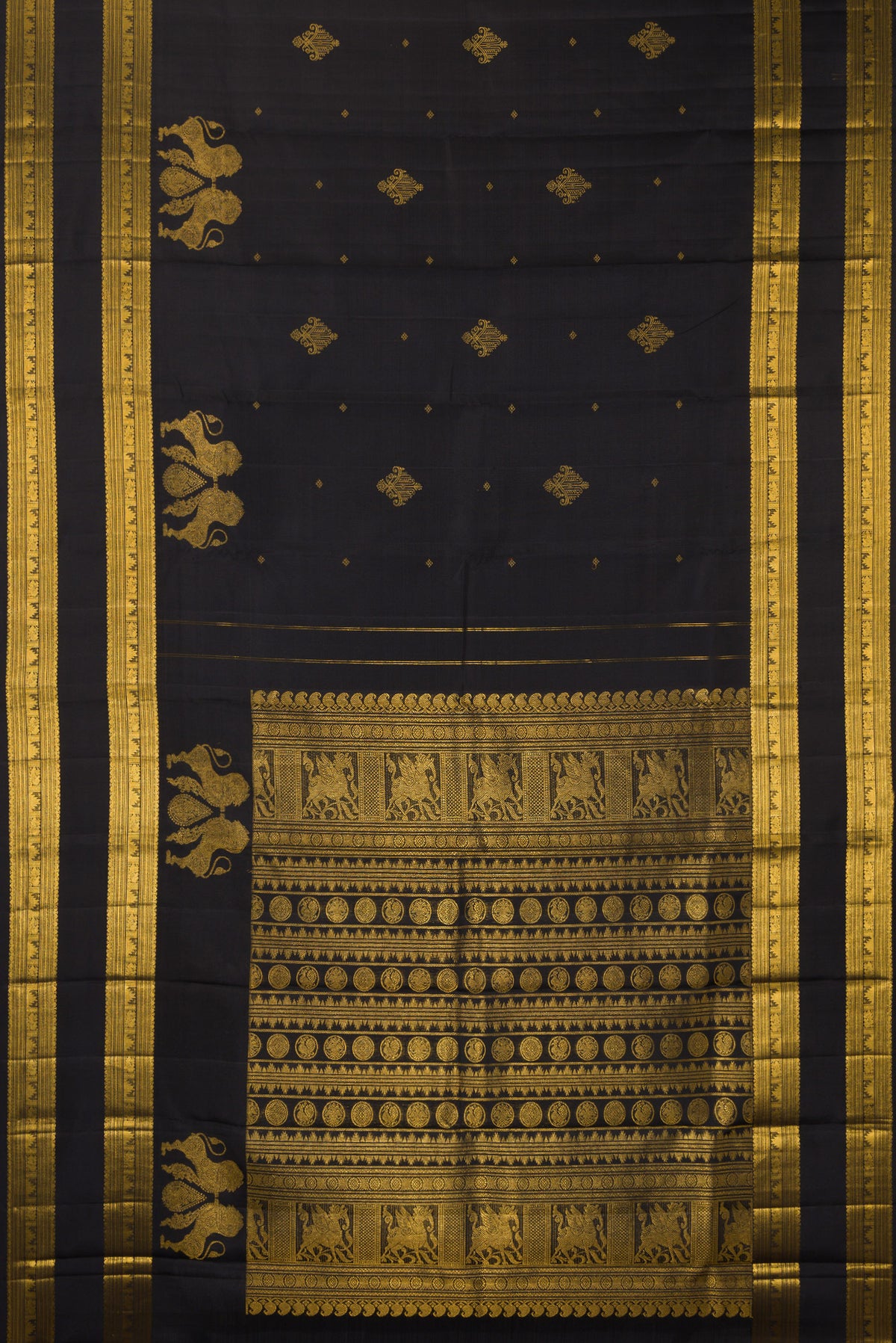 Flat view of Pure Silk Black Kanjivaram Saree with Zari Butta on the body and Zari Border. 