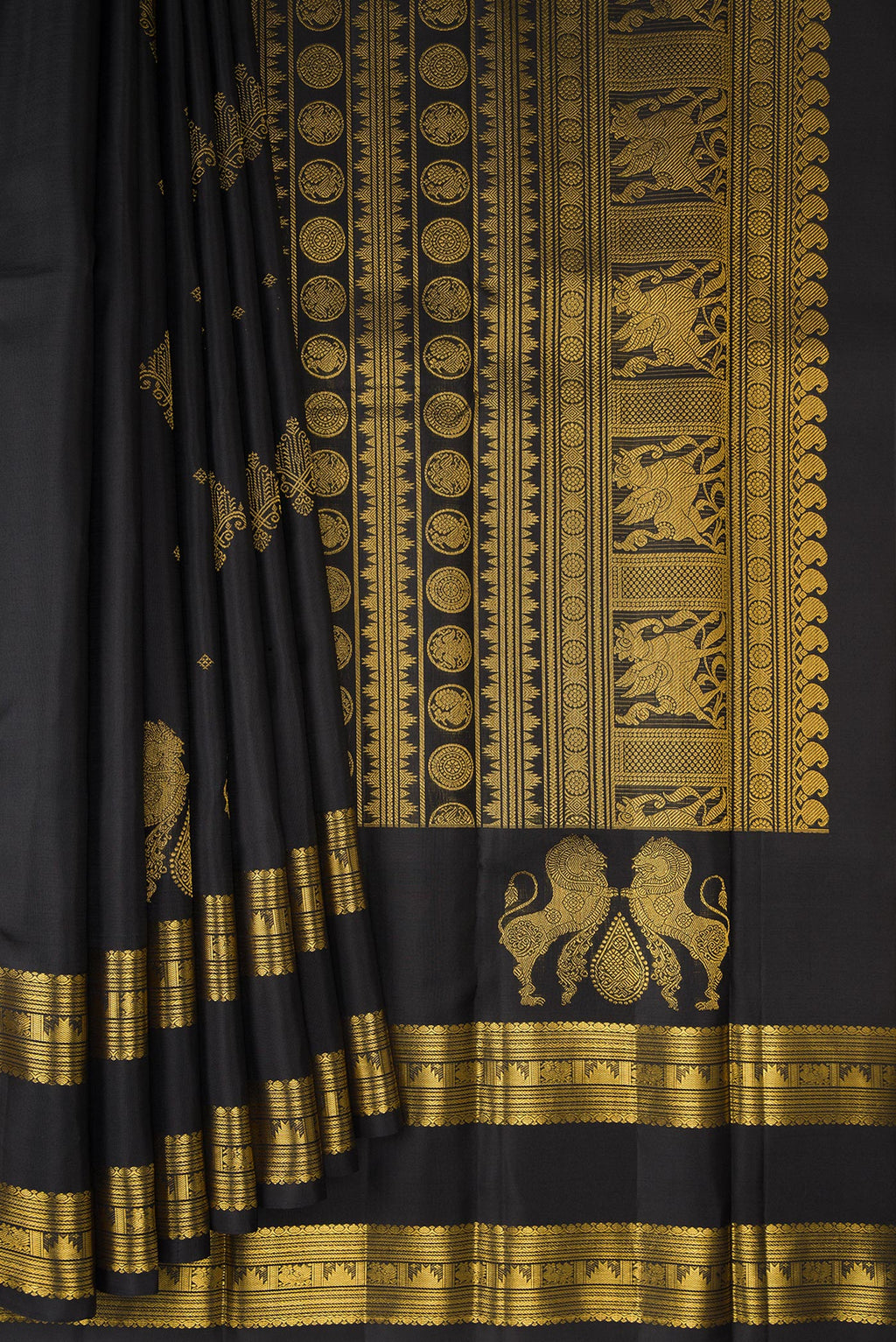 Pleats and pallu of Pure Silk Black Kanjivaram Saree with Zari Butta on the body and Zari Border. 