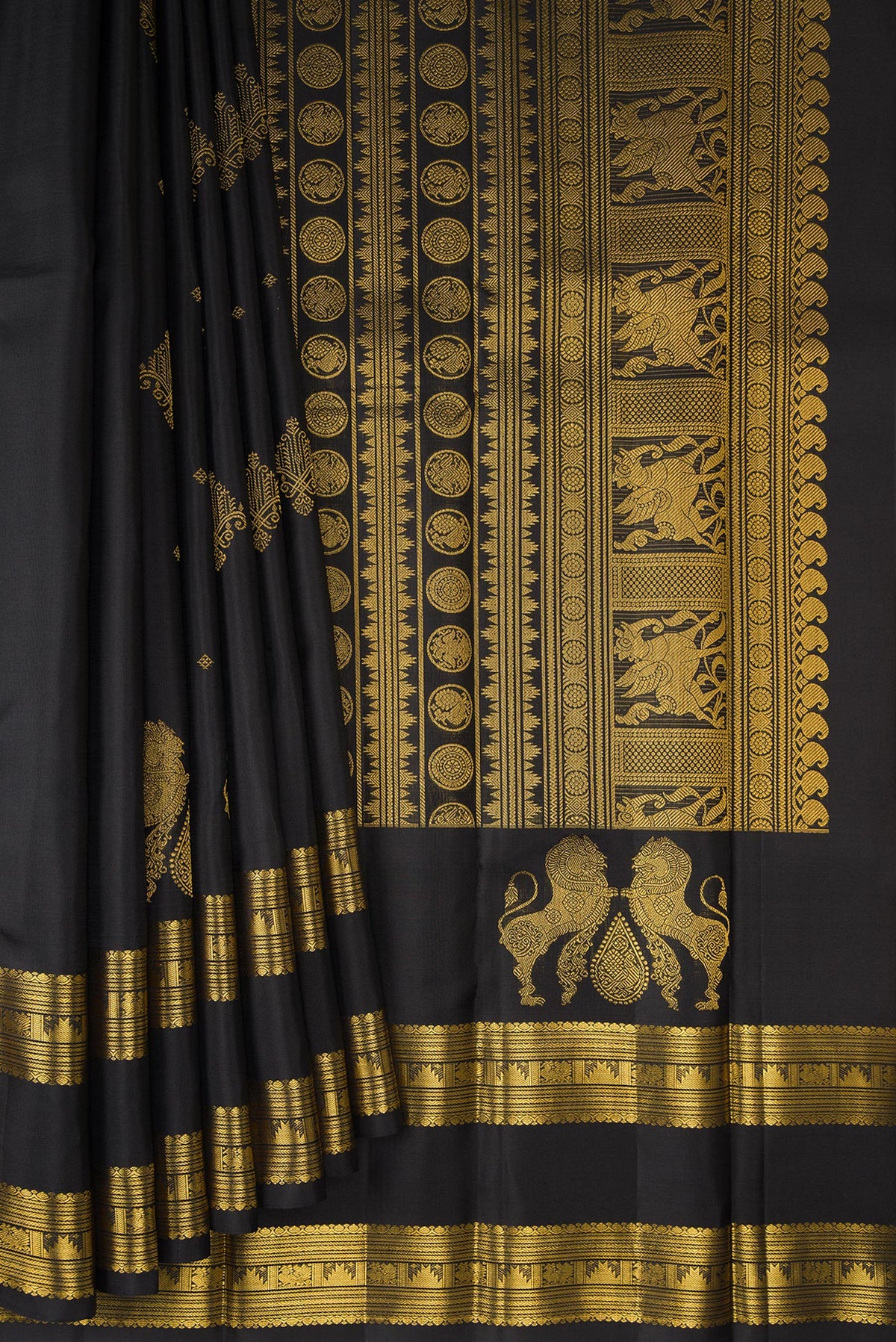 Pleats and pallu of Pure Silk Black Kanjivaram Saree with Zari Butta on the body and Zari Border. 