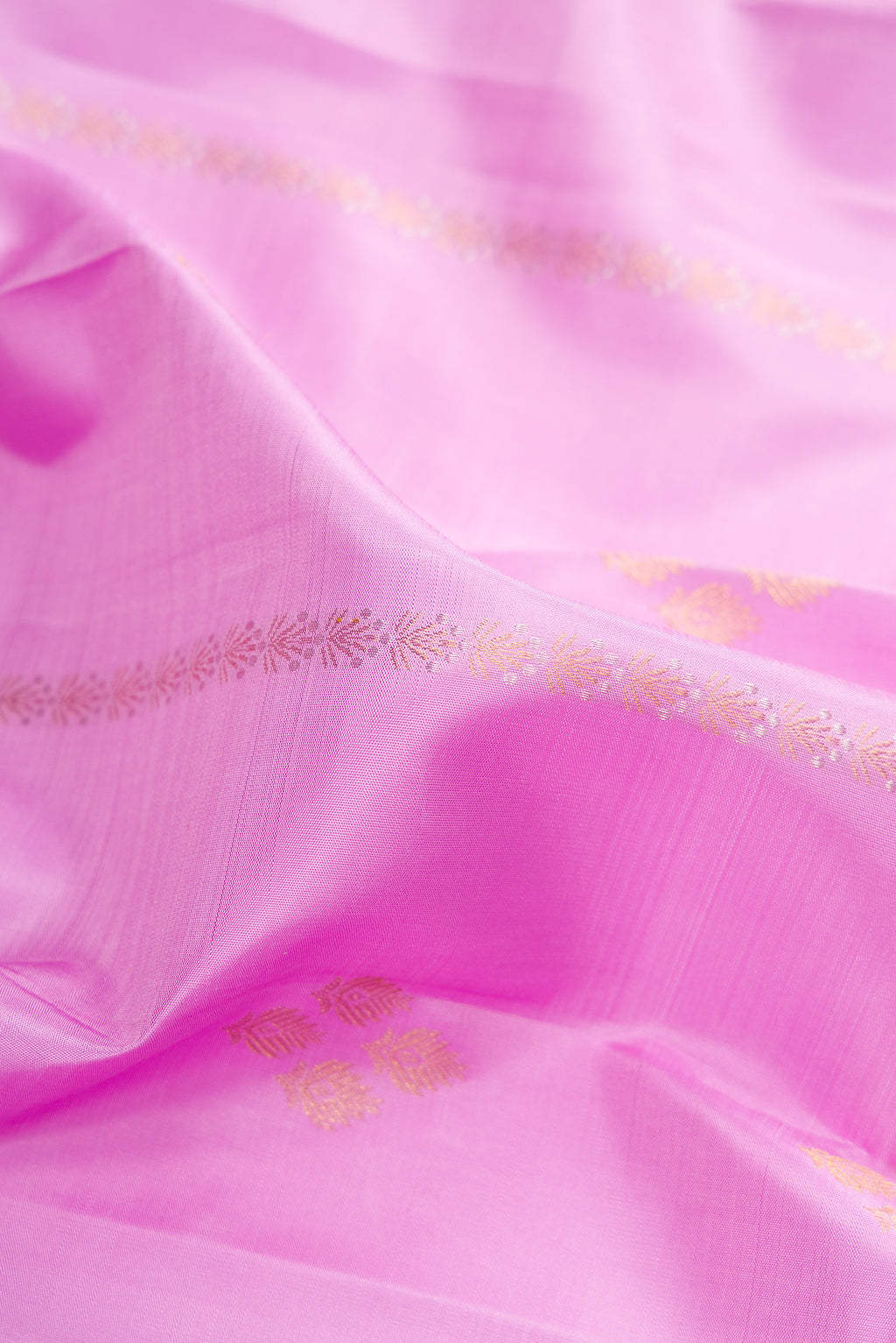 Close up of Pure Silk Lavender Kanjivaram Saree with Zari Butta on the body and Zari Border.  displaying folds