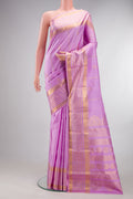 Pure Silk Lavender Kanjivaram Saree with Zari Butta on the body and Zari Border.  displayed on a mannequin