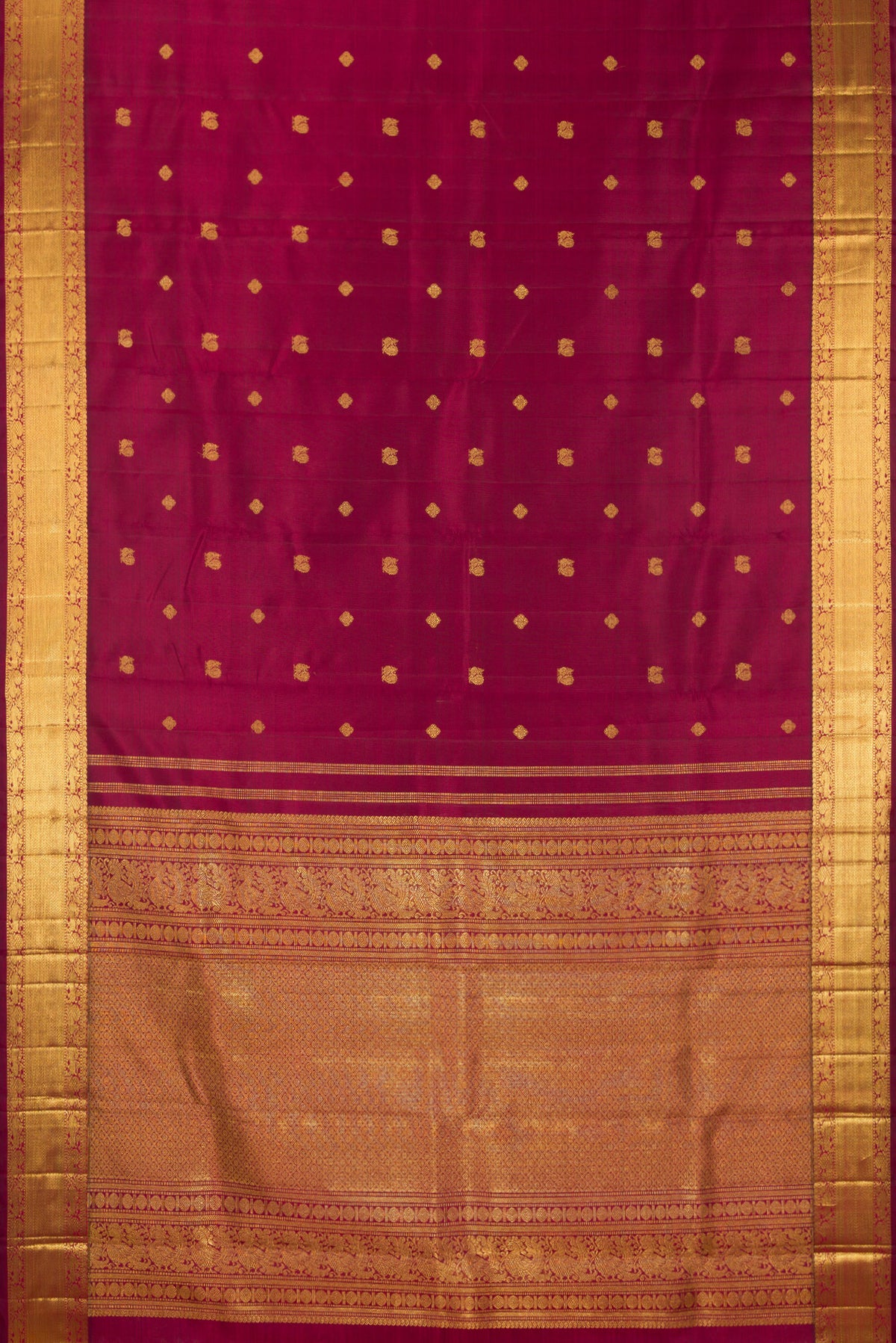 Flat view of Pure Silk Pure Zari Maroon Dual Tone Kanjivaram Saree with Zari Butta on the body and Zari Border. 