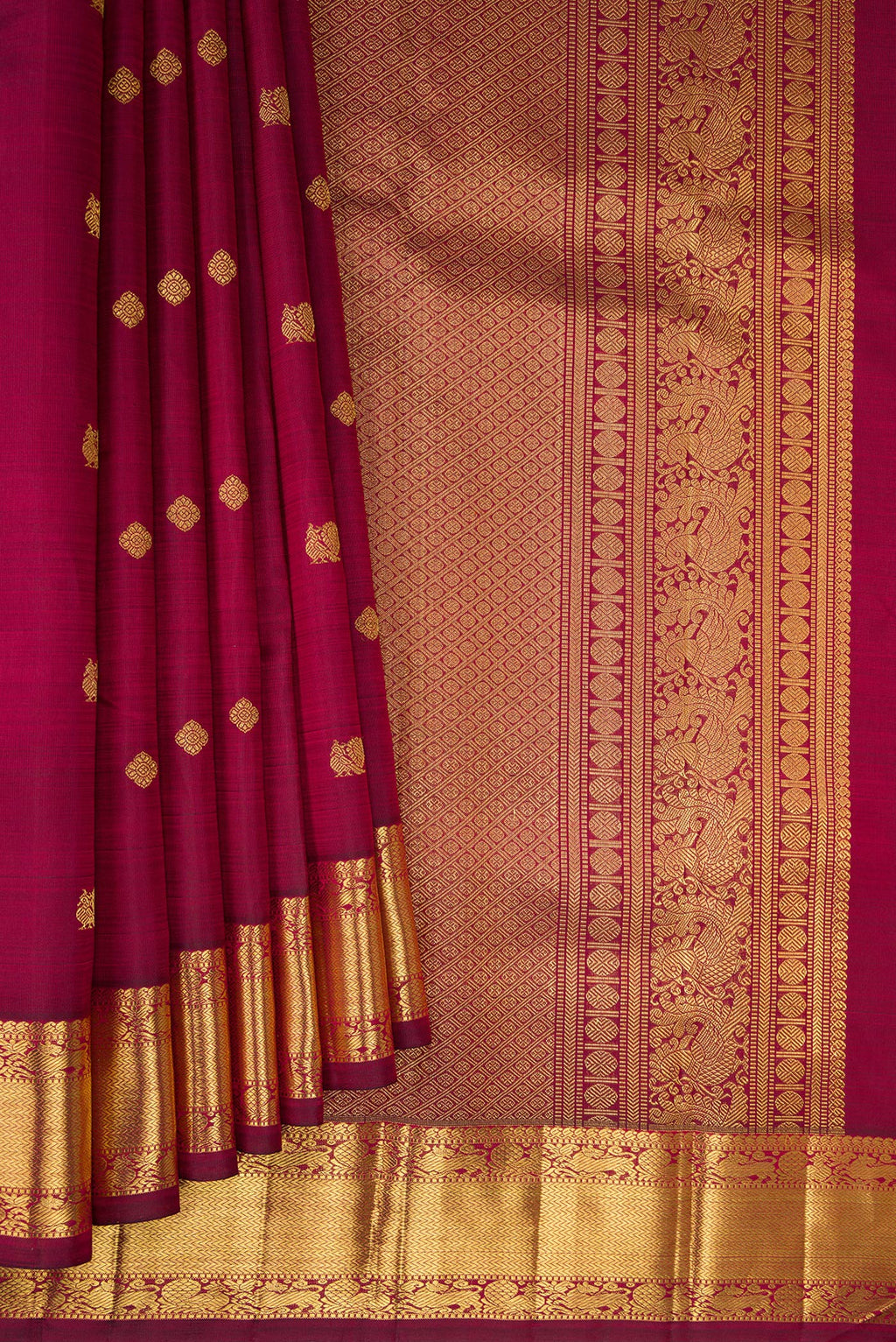 Pleats and pallu of Pure Silk Pure Zari Maroon Dual Tone Kanjivaram Saree with Zari Butta on the body and Zari Border. 