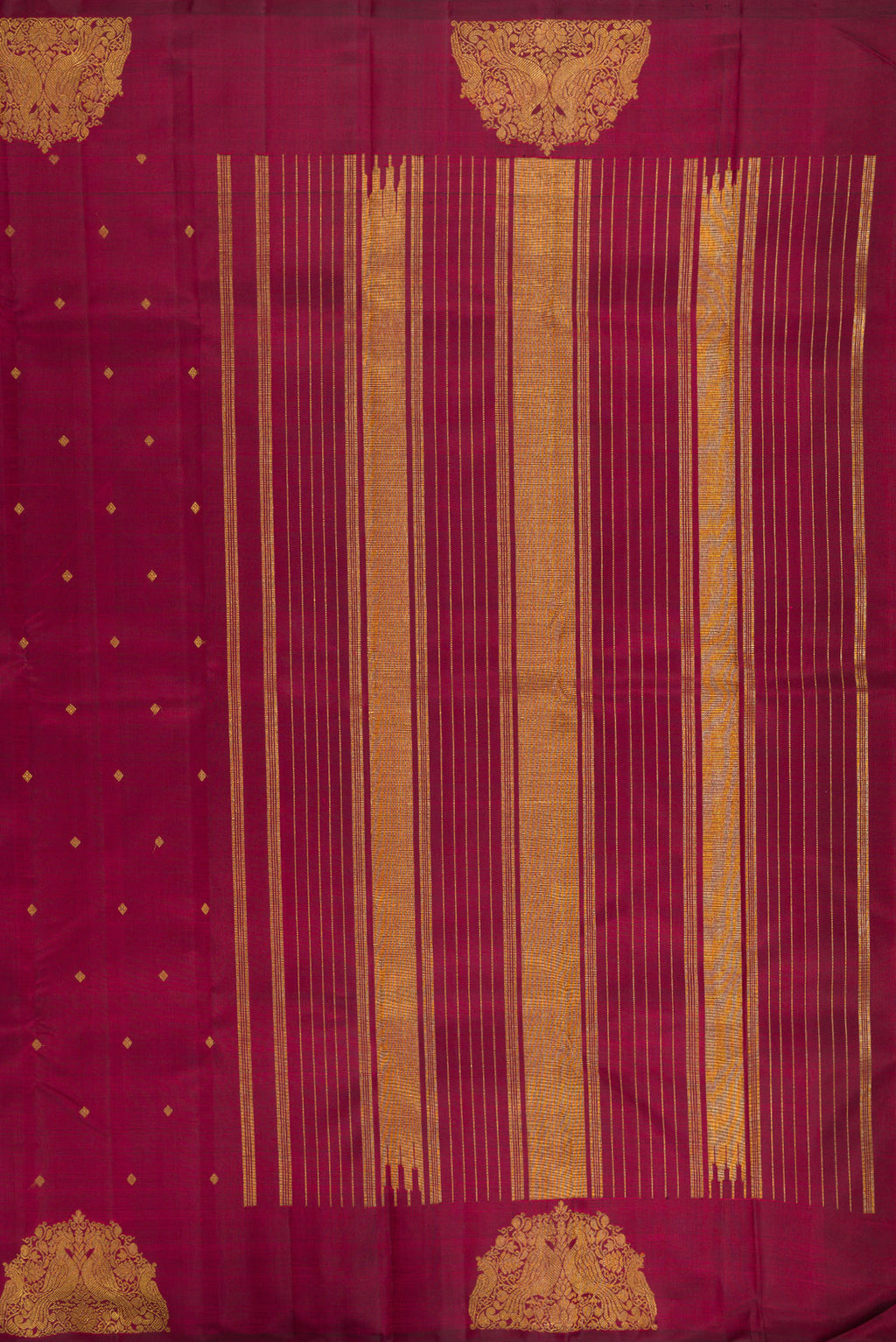 Close up image of the pallu of Pure Silk Pure Zari Maroon Kanchipuram Saree with Zari Butta on the body and Fancy Border. 