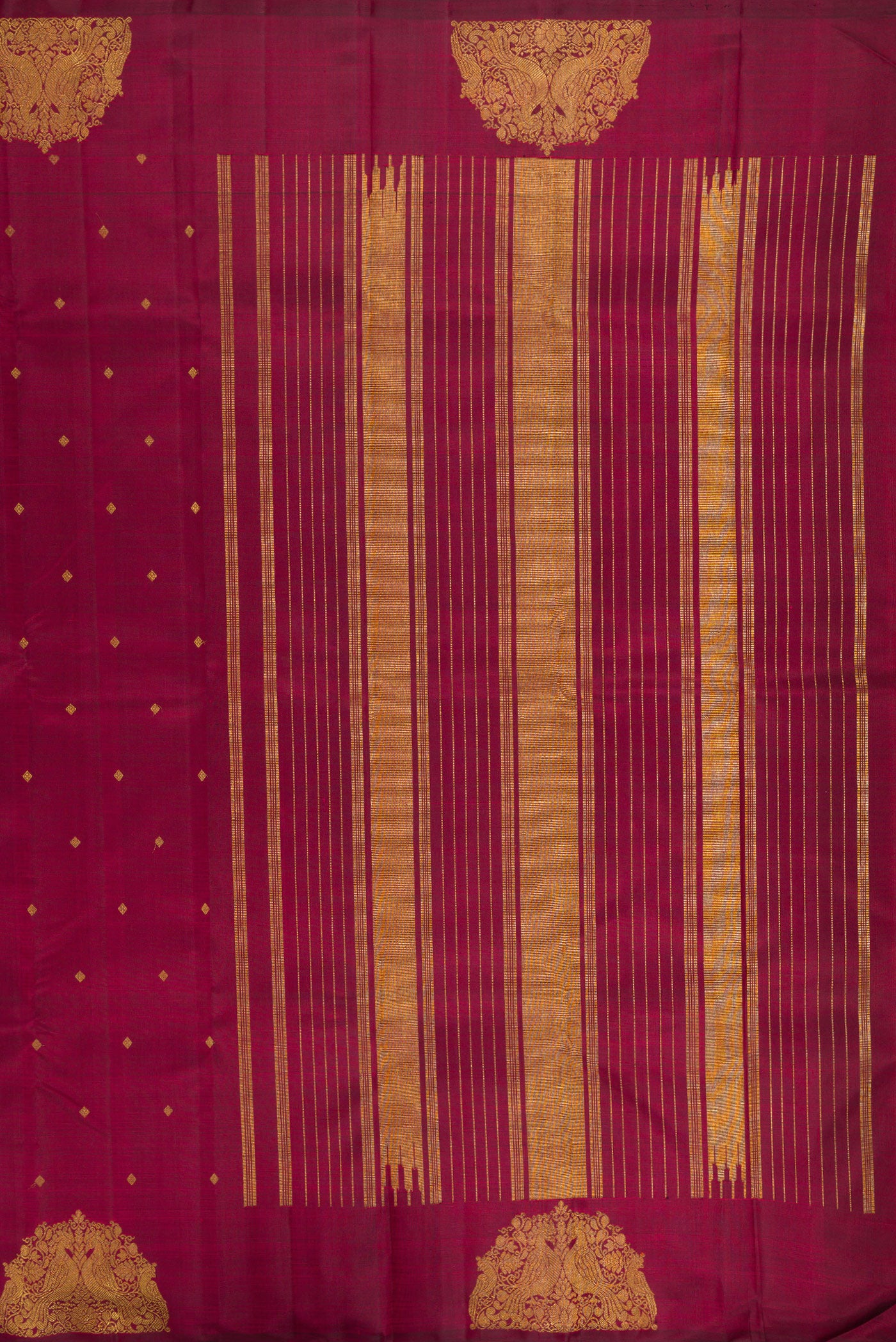 Close up image of the pallu of Pure Silk Pure Zari Maroon Kanchipuram Saree with Zari Butta on the body and Fancy Border. 