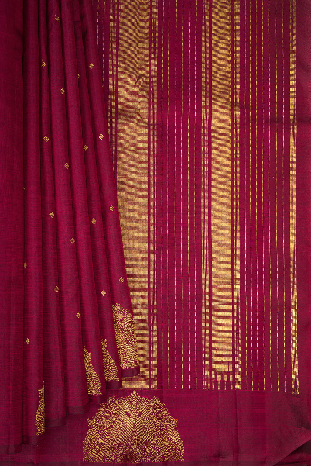 Pleats and pallu of Pure Silk Pure Zari Maroon Kanchipuram Saree with Zari Butta on the body and Fancy Border. 