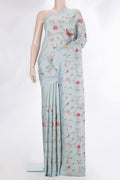 Light Blue Tussar Saree with Embroidery on the body and Embroidery Border.  displayed on a mannequin