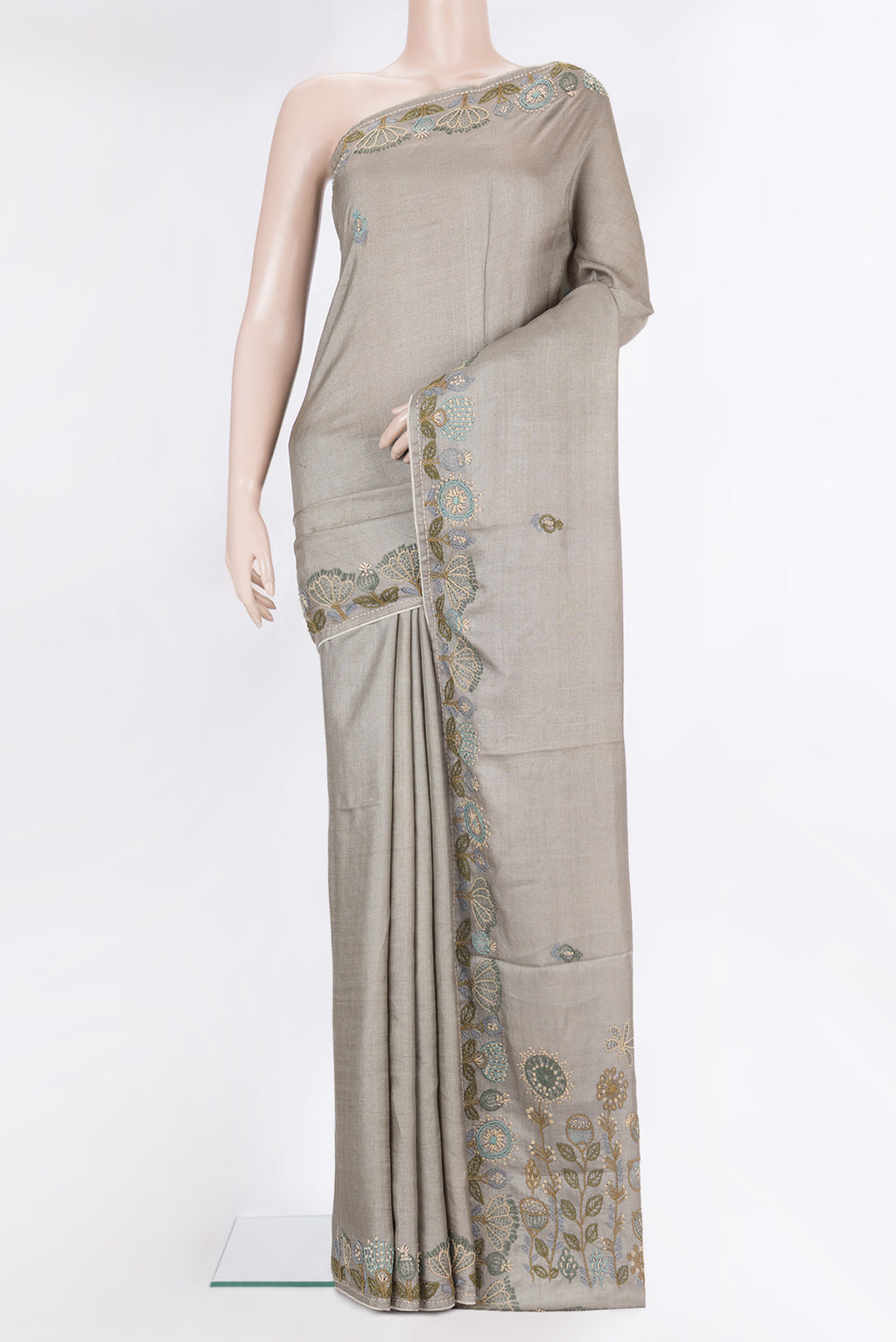 Grey Tussar Saree with Embroidery on the body and Embroidery Border.  displayed on a mannequin