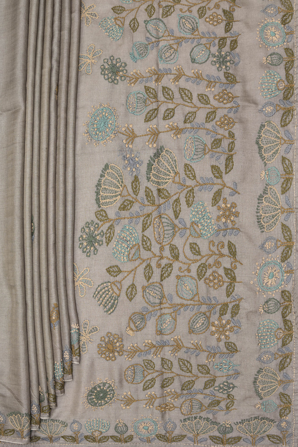 Pleats and pallu of Grey Tussar Saree with Embroidery on the body and Embroidery Border. 