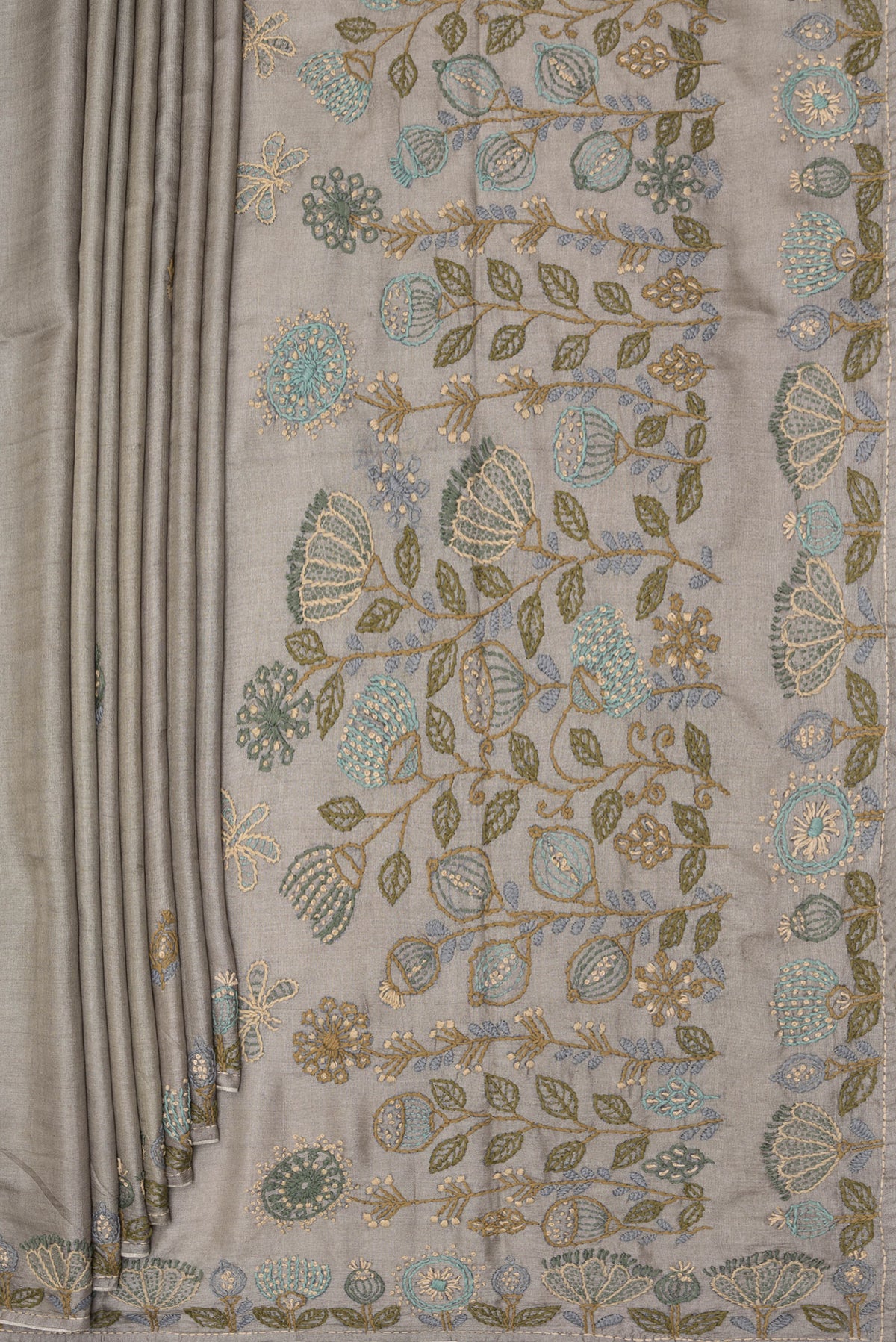 Pleats and pallu of Grey Tussar Saree with Embroidery on the body and Embroidery Border. 