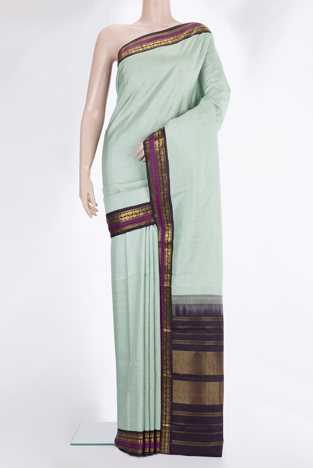Pure Silk Light Green Dual Tone Kanchipuram Saree with Stripes on the body and Zari Border.  displayed on a mannequin