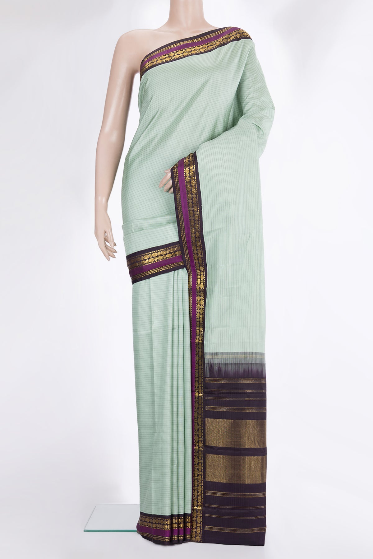 Pure Silk Light Green Dual Tone Kanchipuram Saree with Stripes on the body and Zari Border.  displayed on a mannequin