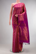 Pure Silk Magenta Kanjivaram Saree with Zari Brocade on the body and Without Border.  displayed on a mannequin
